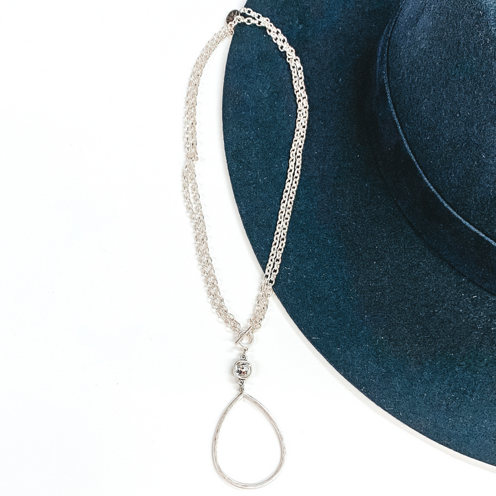 Pink Panache | Silver Open Teardrop Pendant with Clear Cushion Cut Crystal on a Double Silver Chained Necklace with Toggle Front - Giddy Up Glamour Boutique