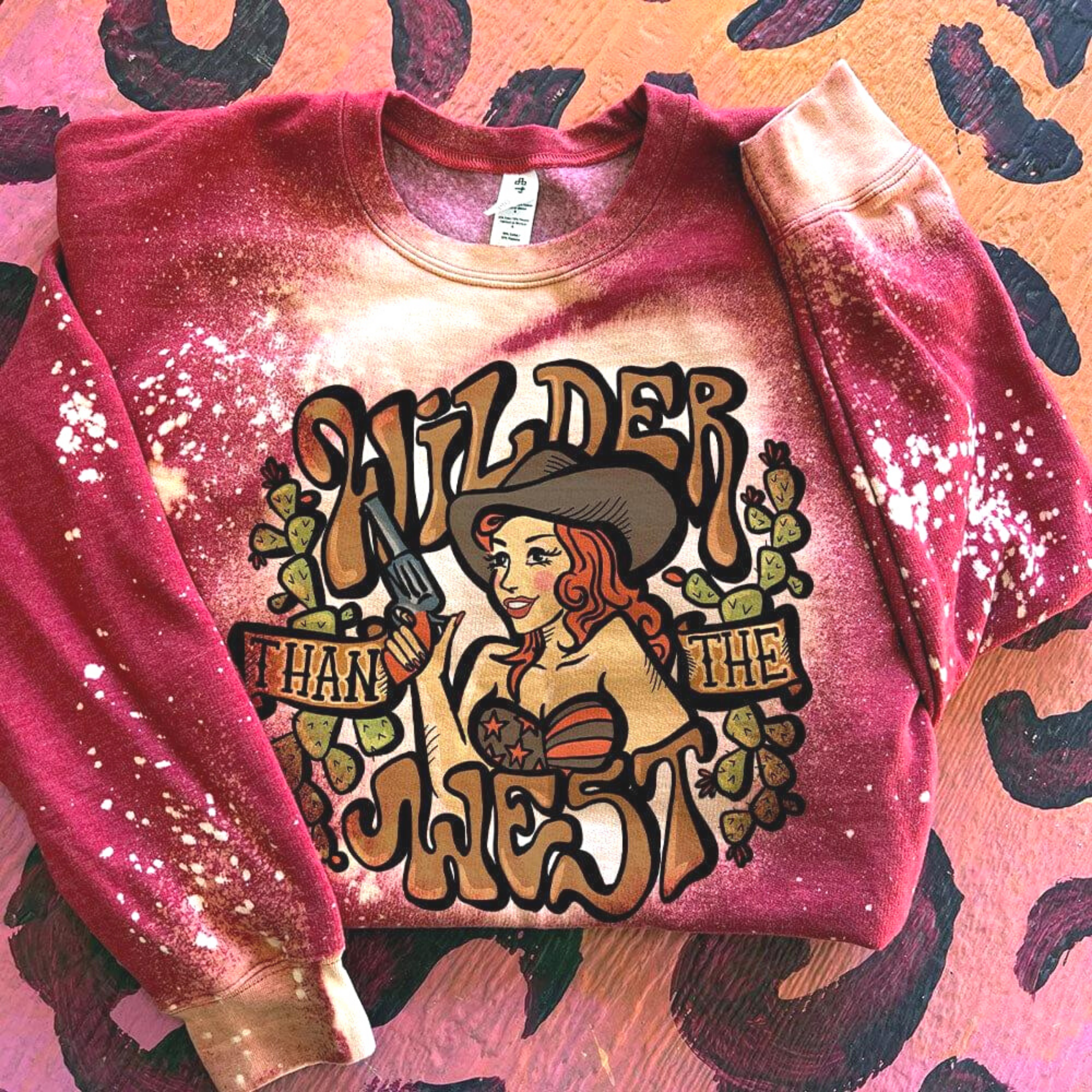 Online Exclusive | Wilder Than The West Long Sleeve Bleached Cowgirl Graphic Sweatshirt in Red - Giddy Up Glamour Boutique