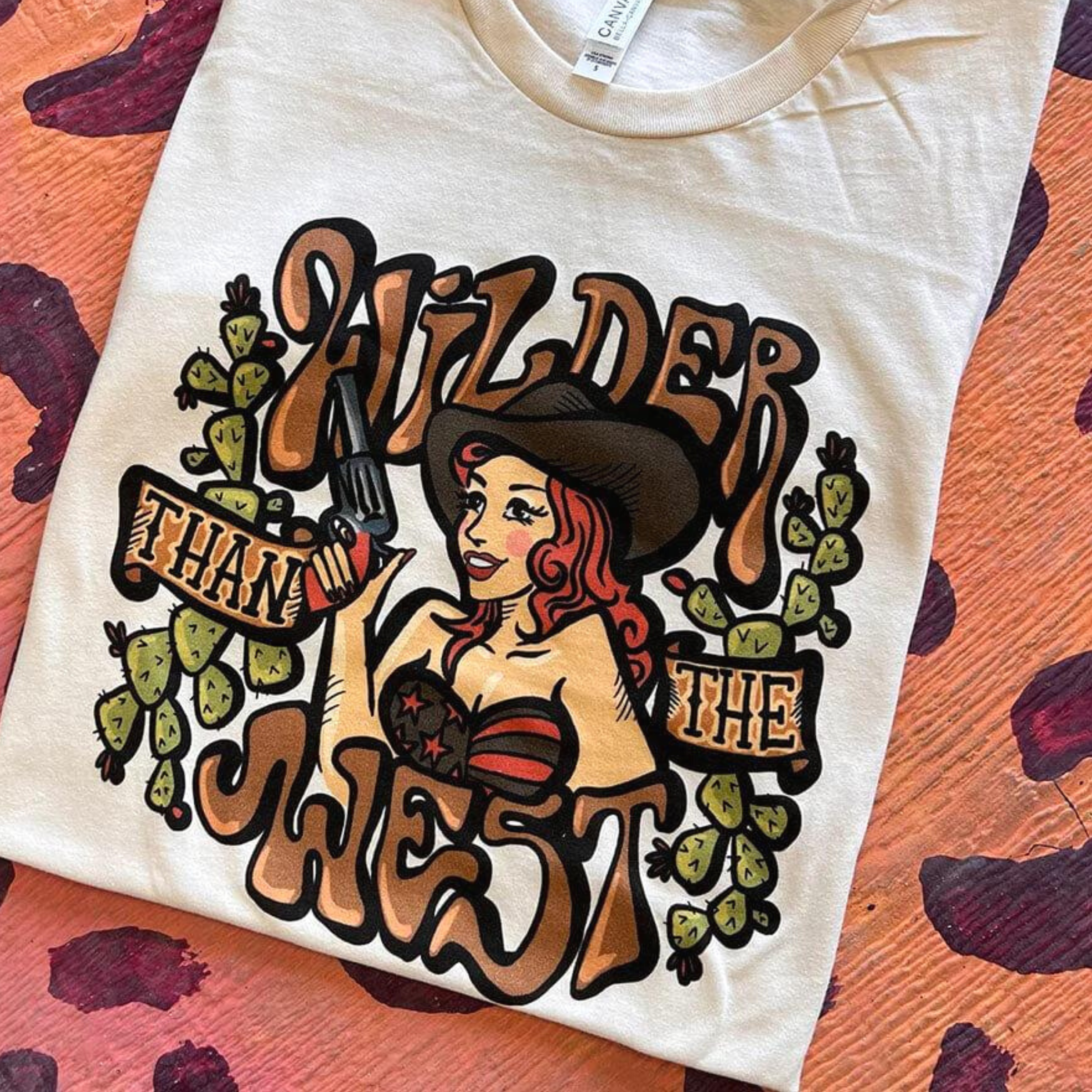Online Exclusive | Wilder Than The West Short Sleeve Cowgirl Graphic Tee in Cream - Giddy Up Glamour Boutique