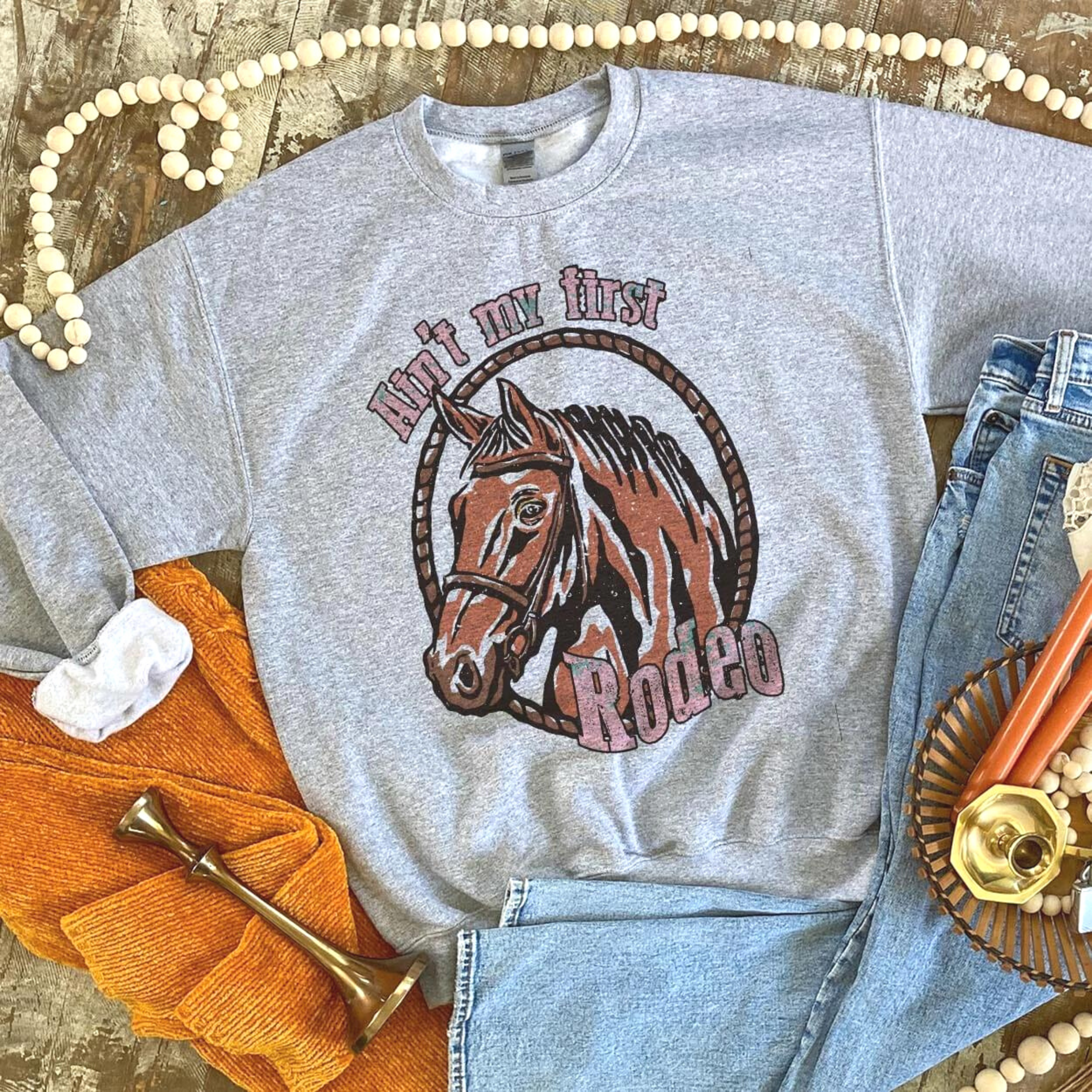 Online Exclusive | Ain't My First Rodeo Long Sleeve Sweatshirt in Gray - Giddy Up Glamour Boutique