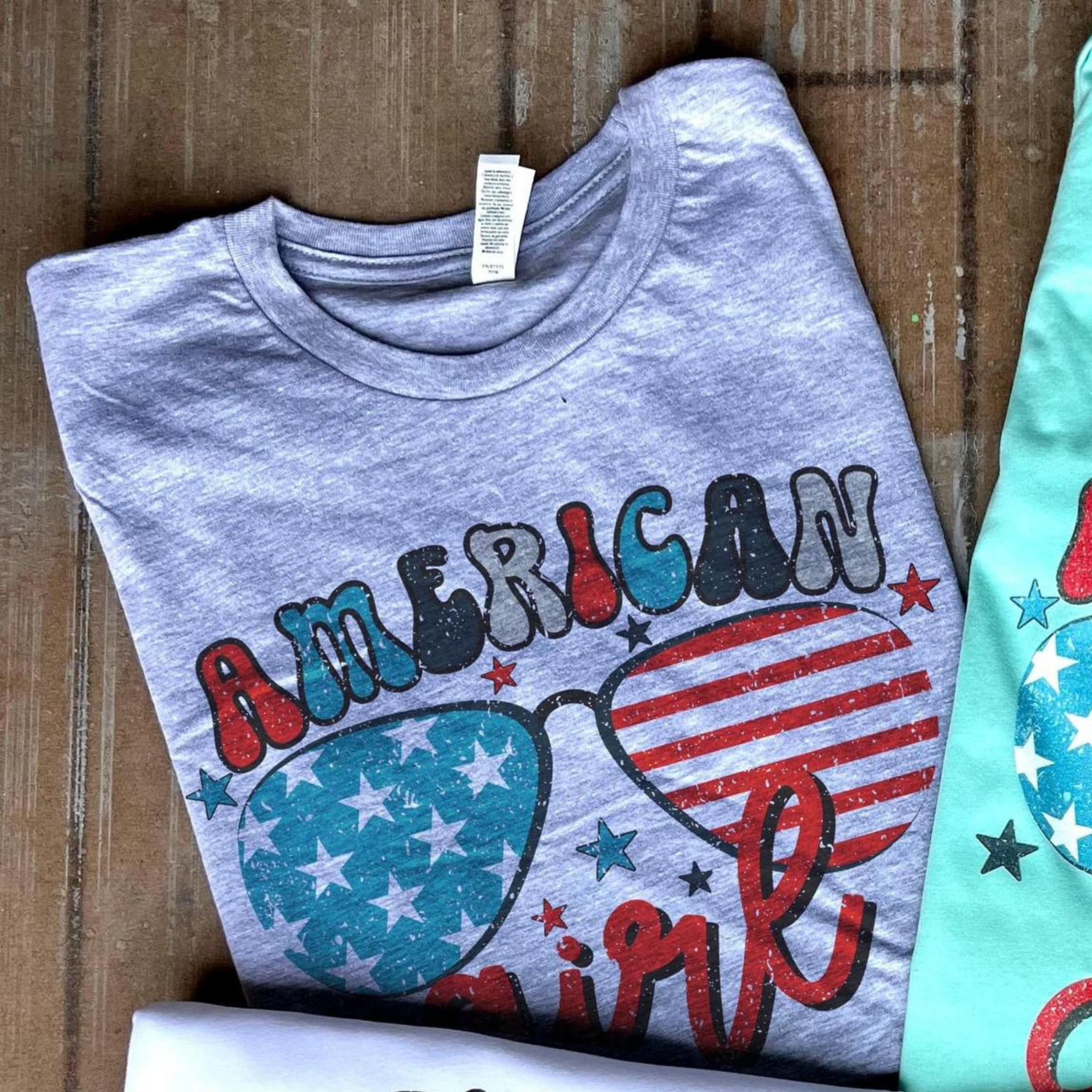 Online Exclusive | American Girl with Stars and Glasses Graphic Tee in Gray - Giddy Up Glamour Boutique