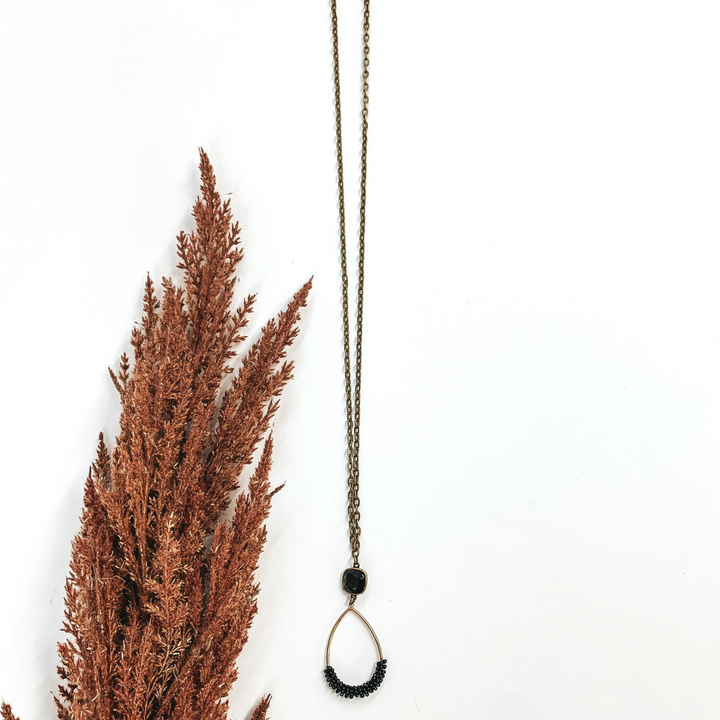 Pink Panache | Bronze Teardrop Pendant with Crystal Detailing and Black Cushion Cut Stud in Black - Giddy Up Glamour Boutique