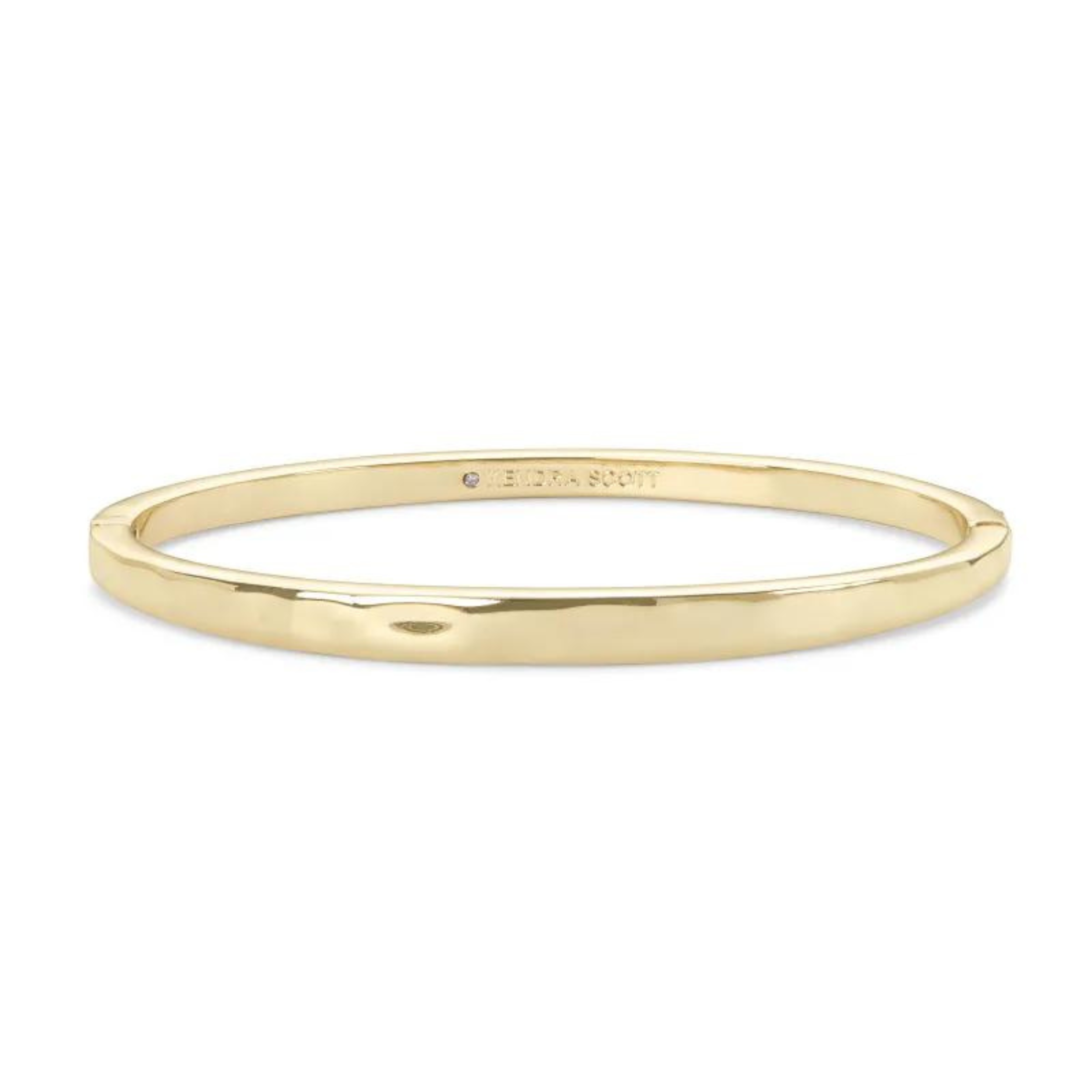 Gold bangle bracelet, pictured on a white background.