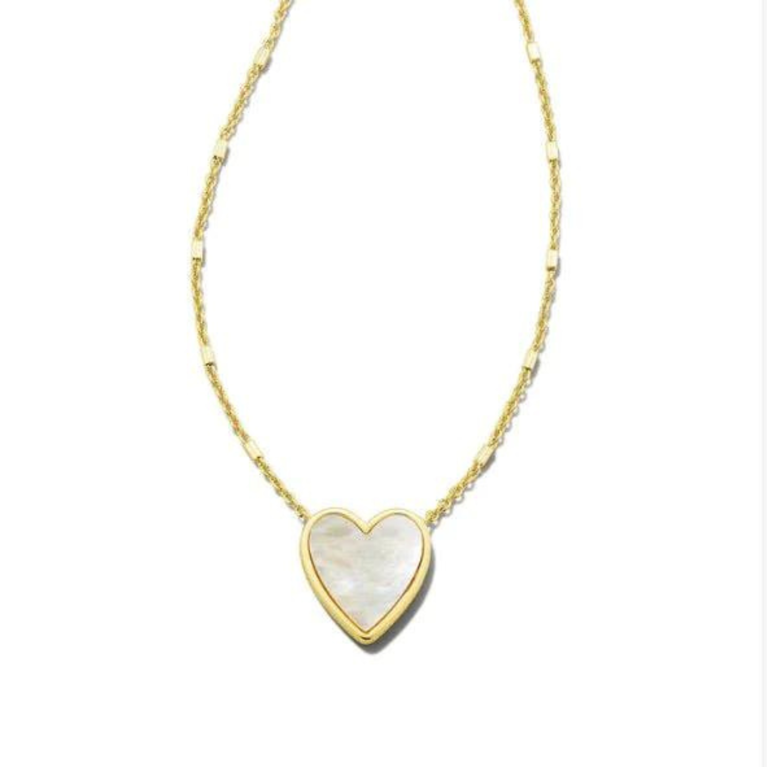 Gold heart necklace with ivory mother of pearl stone, pictured on a white background.