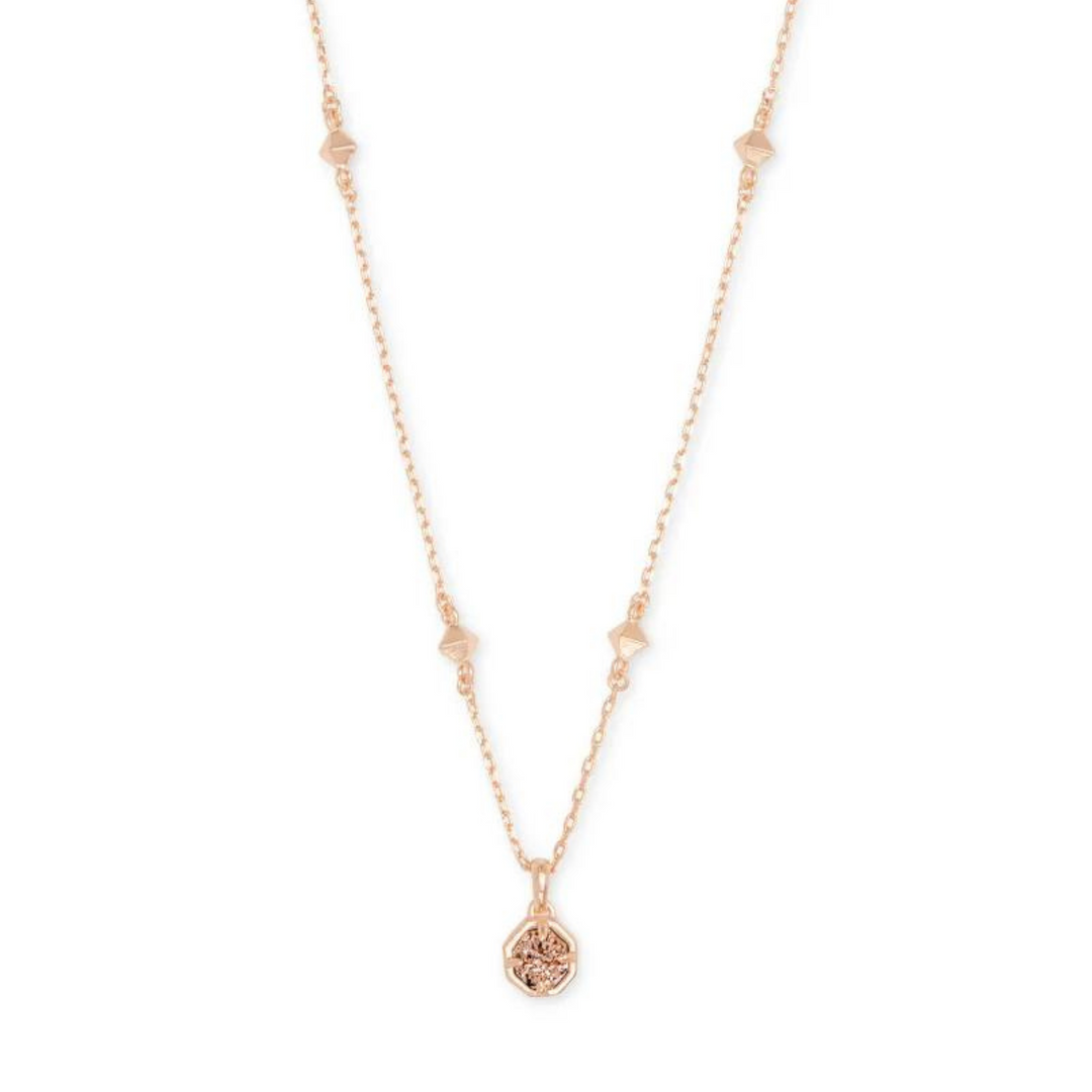Rose gold necklace with rose gold drusy pendant, pictured on a white background.