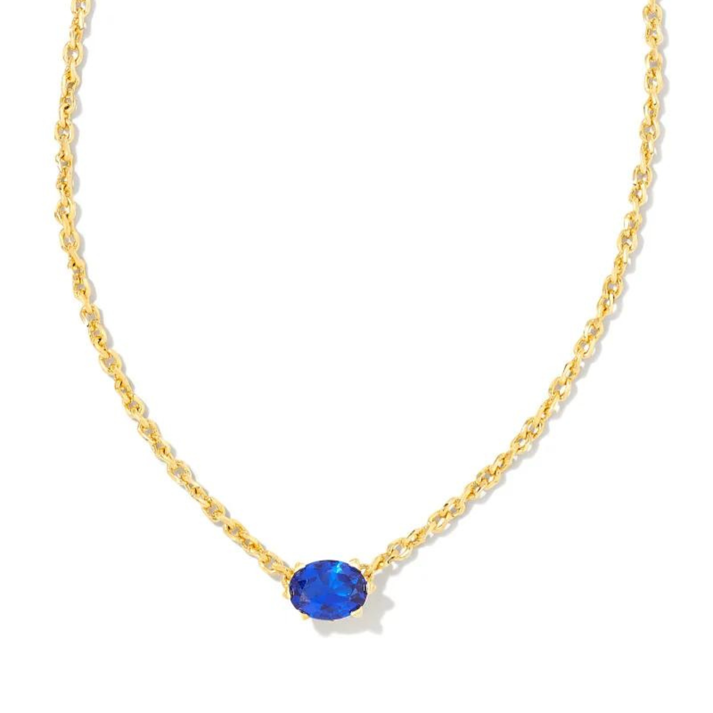 Gold chain necklace with a blue crystal pendant, pictured on a white background.