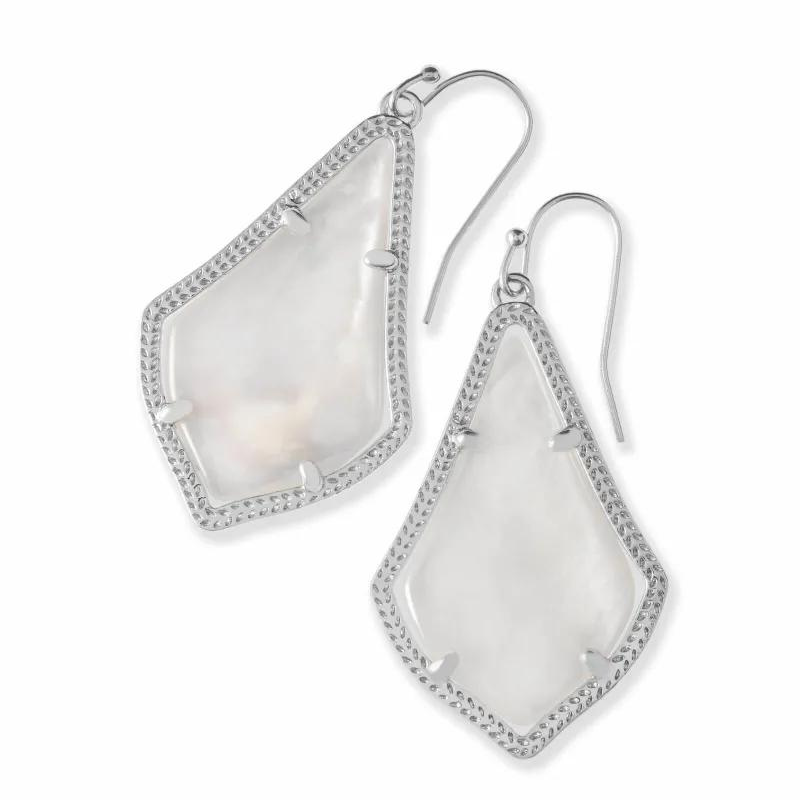 Silver dangle earrings with ivory pearl stones, pictured on a white background.