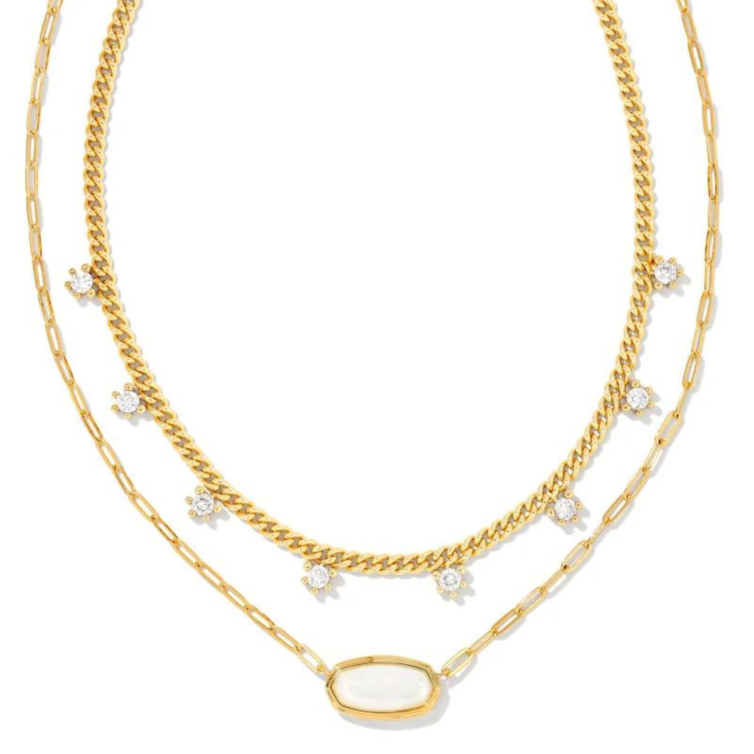 Gold multi strand necklace with white crystals and a gold iridescent opalite illusion stone, pictured on a white background. 