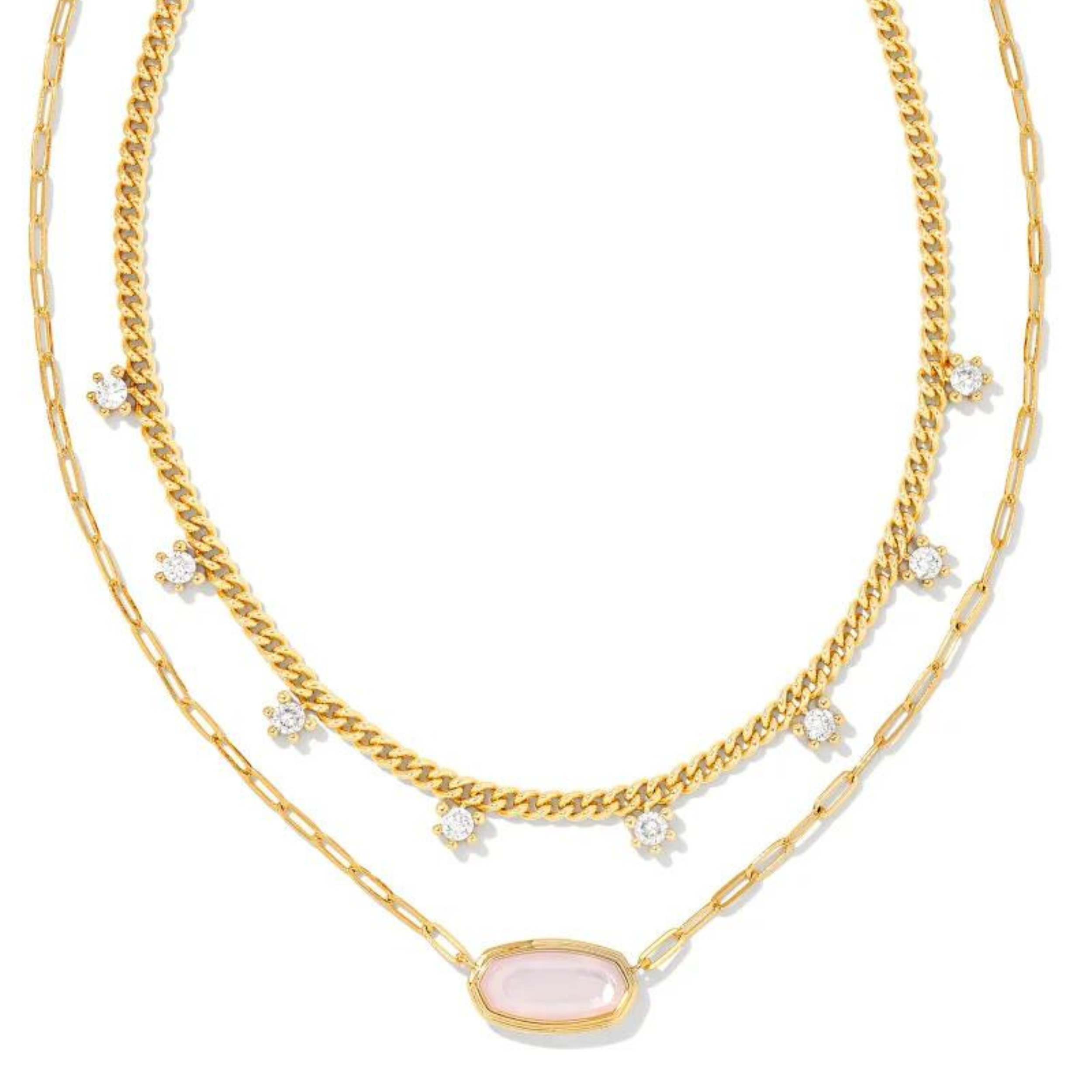 Gold multi strand necklace with white crystals and a Pink Opalite Illusion stone, pictured on a white background. 