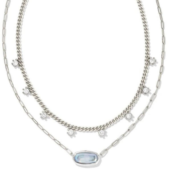 Silver multi strand necklace with white crystals and a sky blue illusion pendant, pictured on a white background.