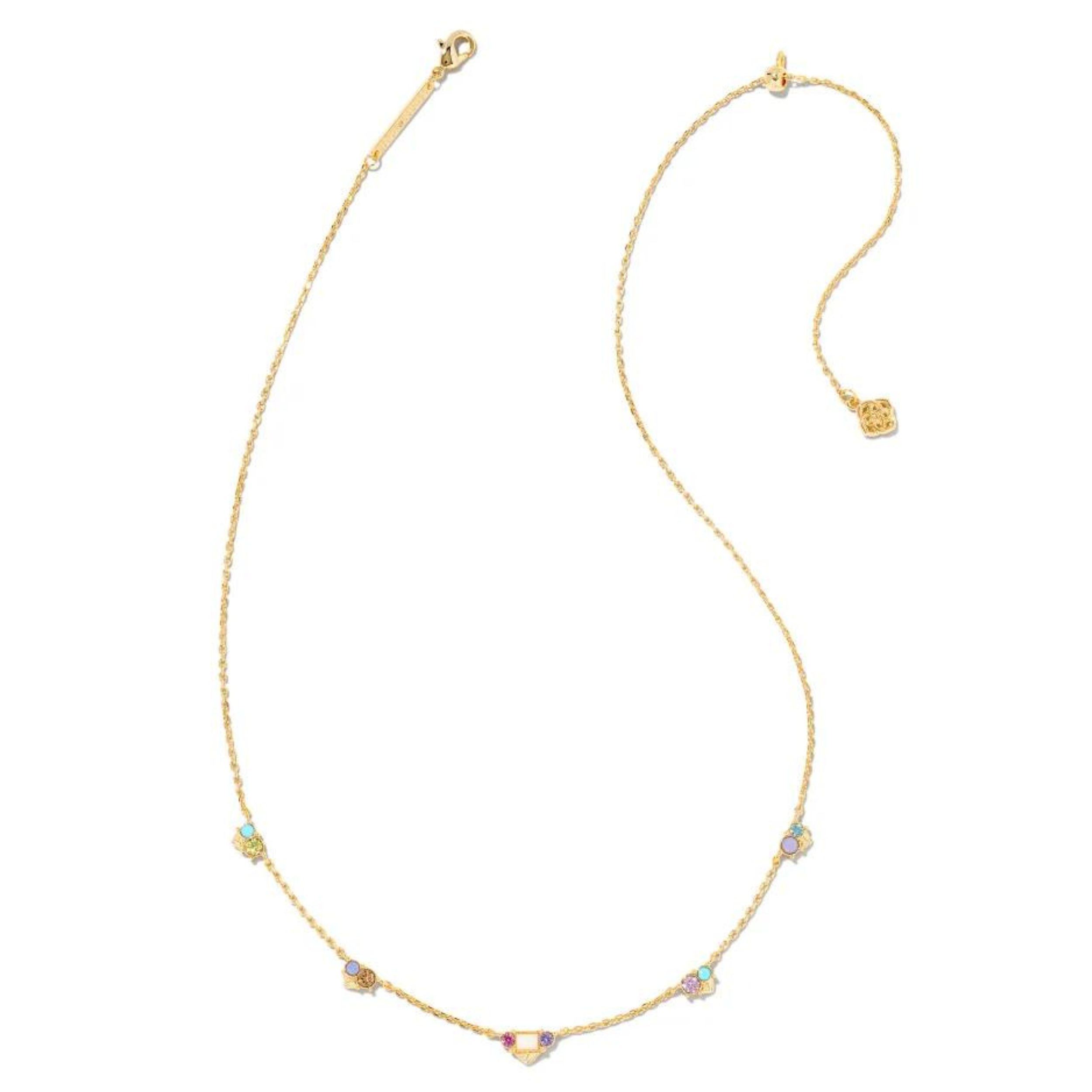 Gold necklace with pastel mix crystals, pictured on a white background.