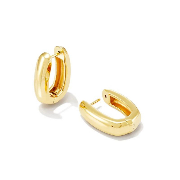 Gold hoop earrings, pictured on a background.