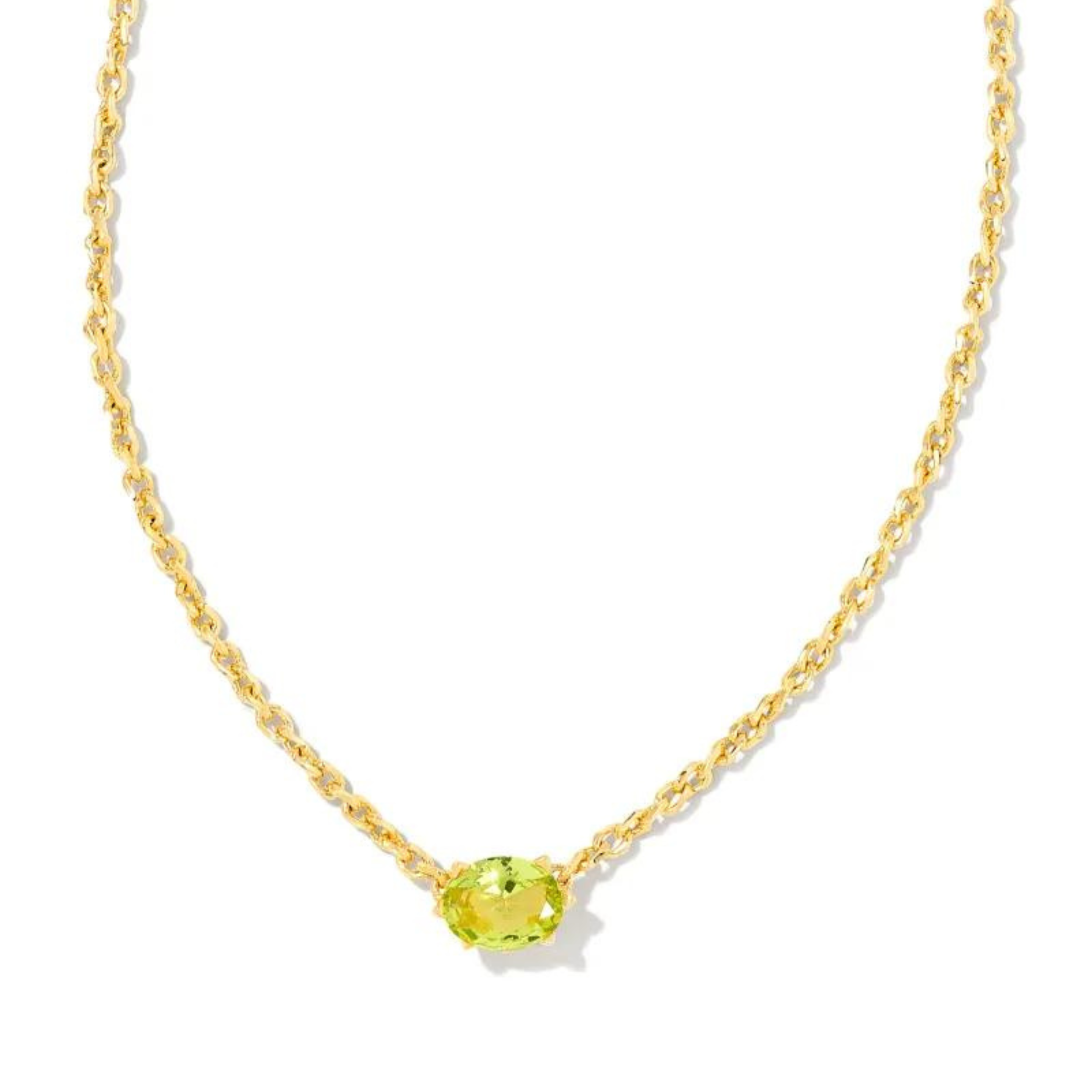 Gold necklace with green peridot crystal stone, pictured on a white background.