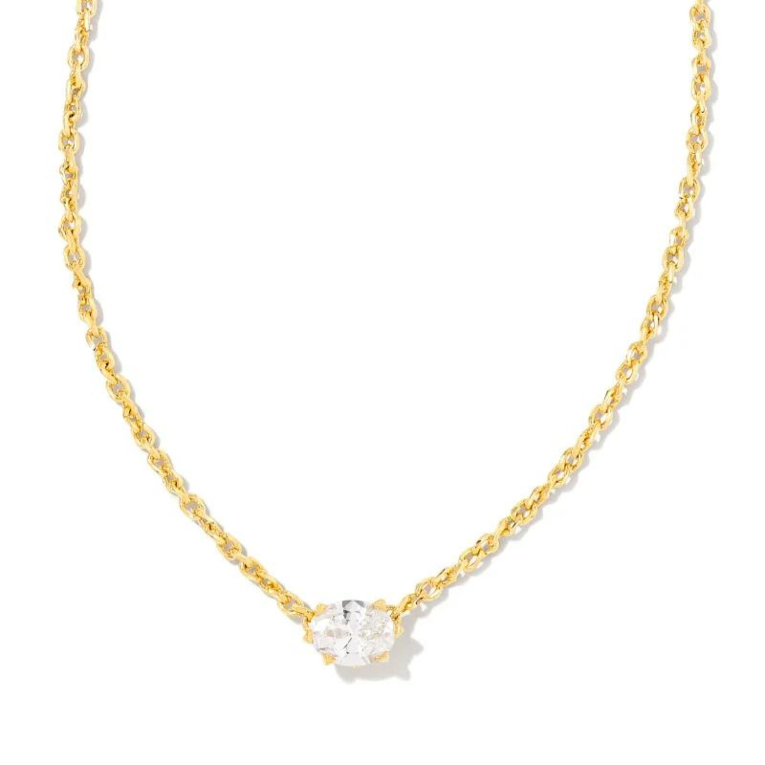 Gold necklace with white crystal stone, pictured on a white background.