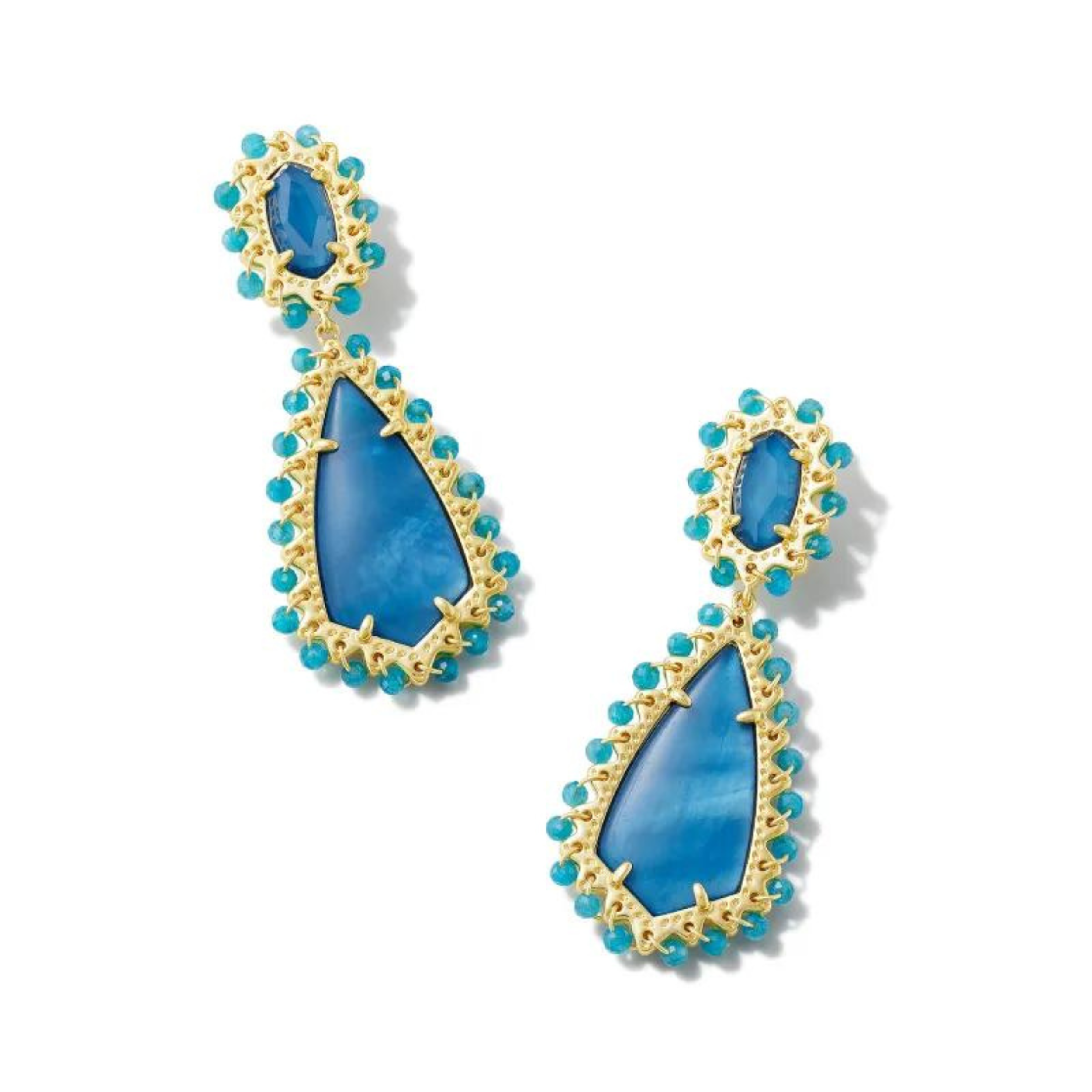 Gold post dangle earrings with a blue mix stone with a blue beaded trim, pictured on a white background.