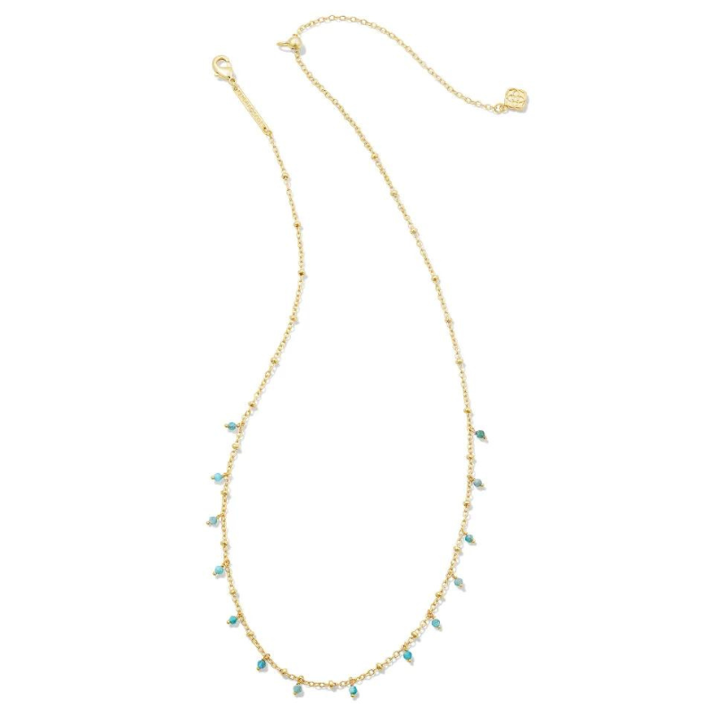 Gold strand necklace with aqua apatite beads, pictured on a white background.