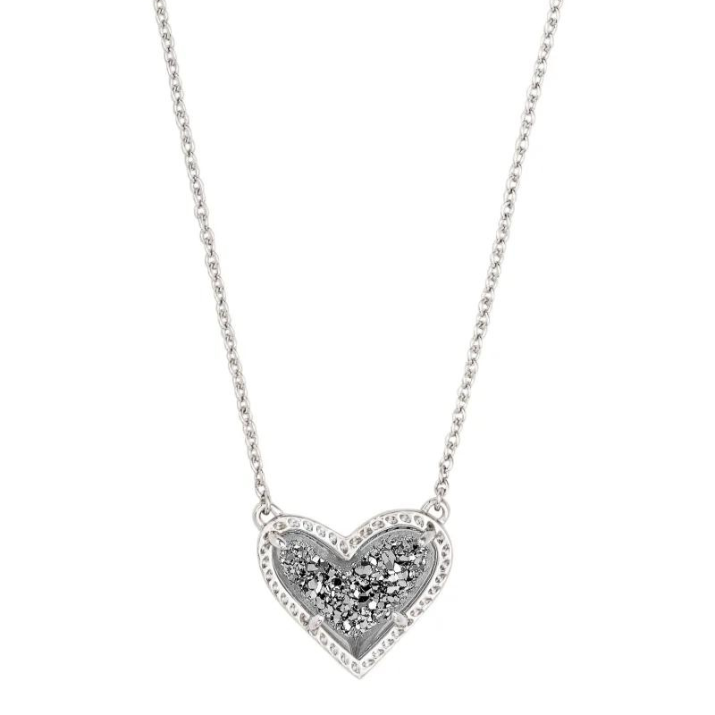 Silver necklace with platinum drusy heart pendant, pictured on white ackground.