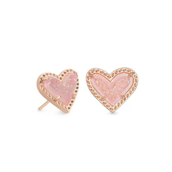 Pink heart shaped stud earrings pictured on a white background.