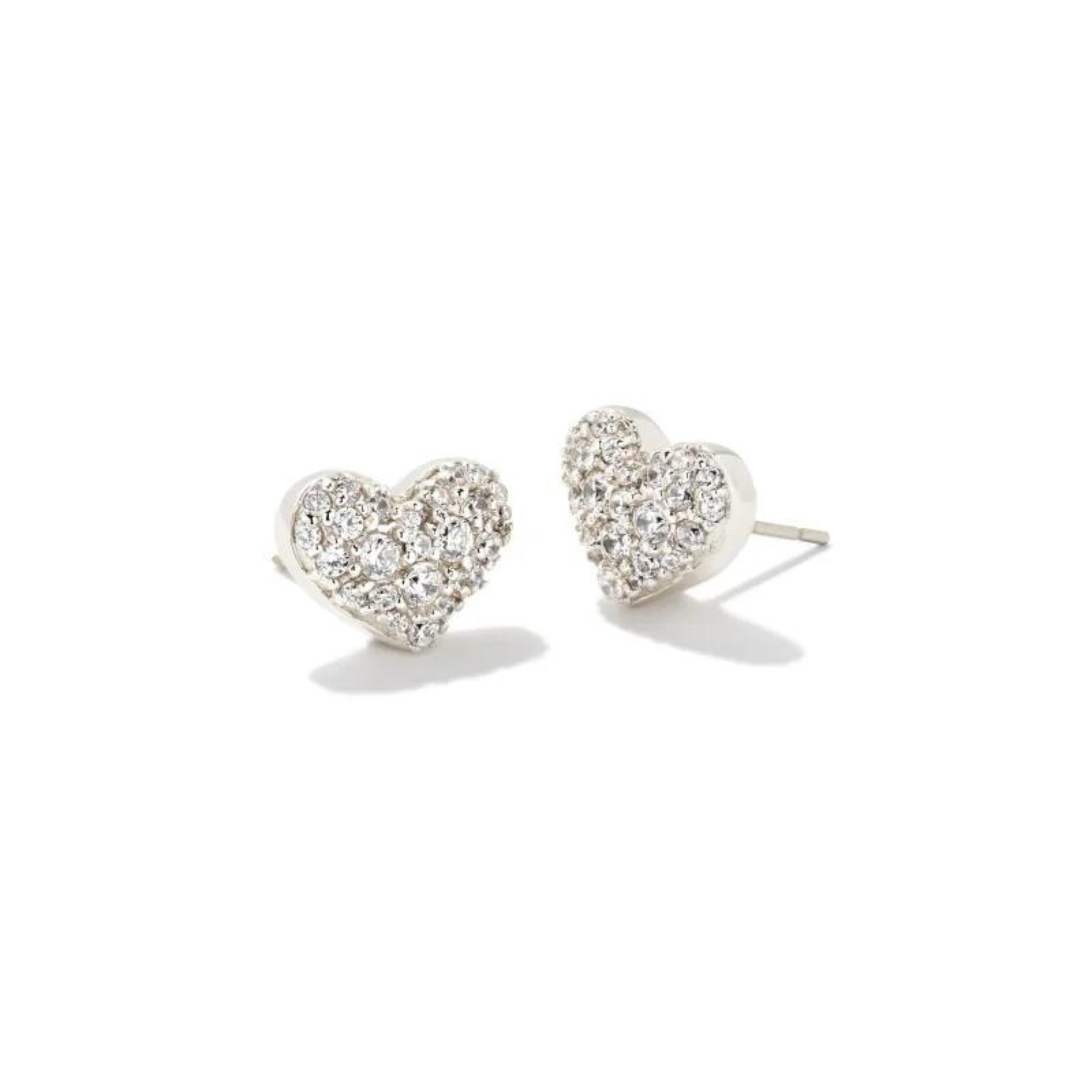 Silver stud heart shaped earrings with white crystals pictured on a white background.
