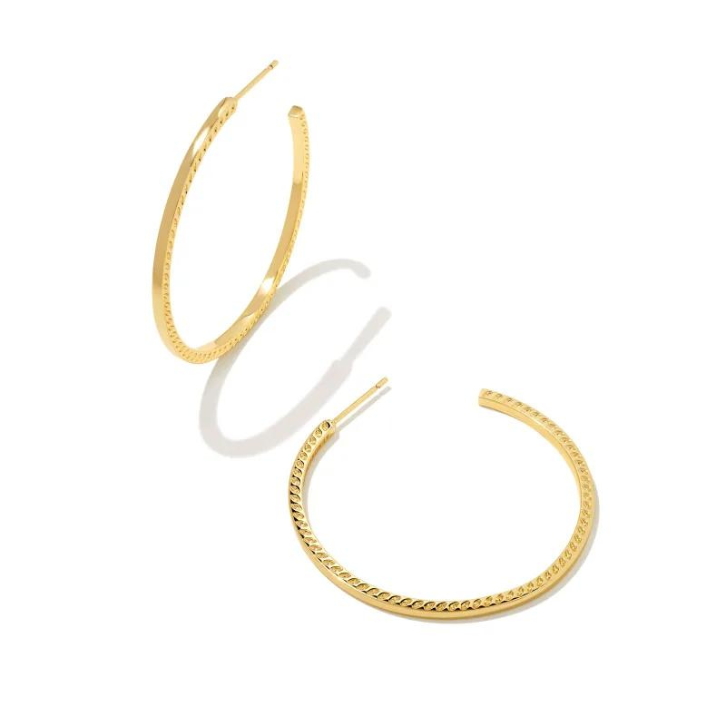 Gold hoop earrings pictured on a white background.