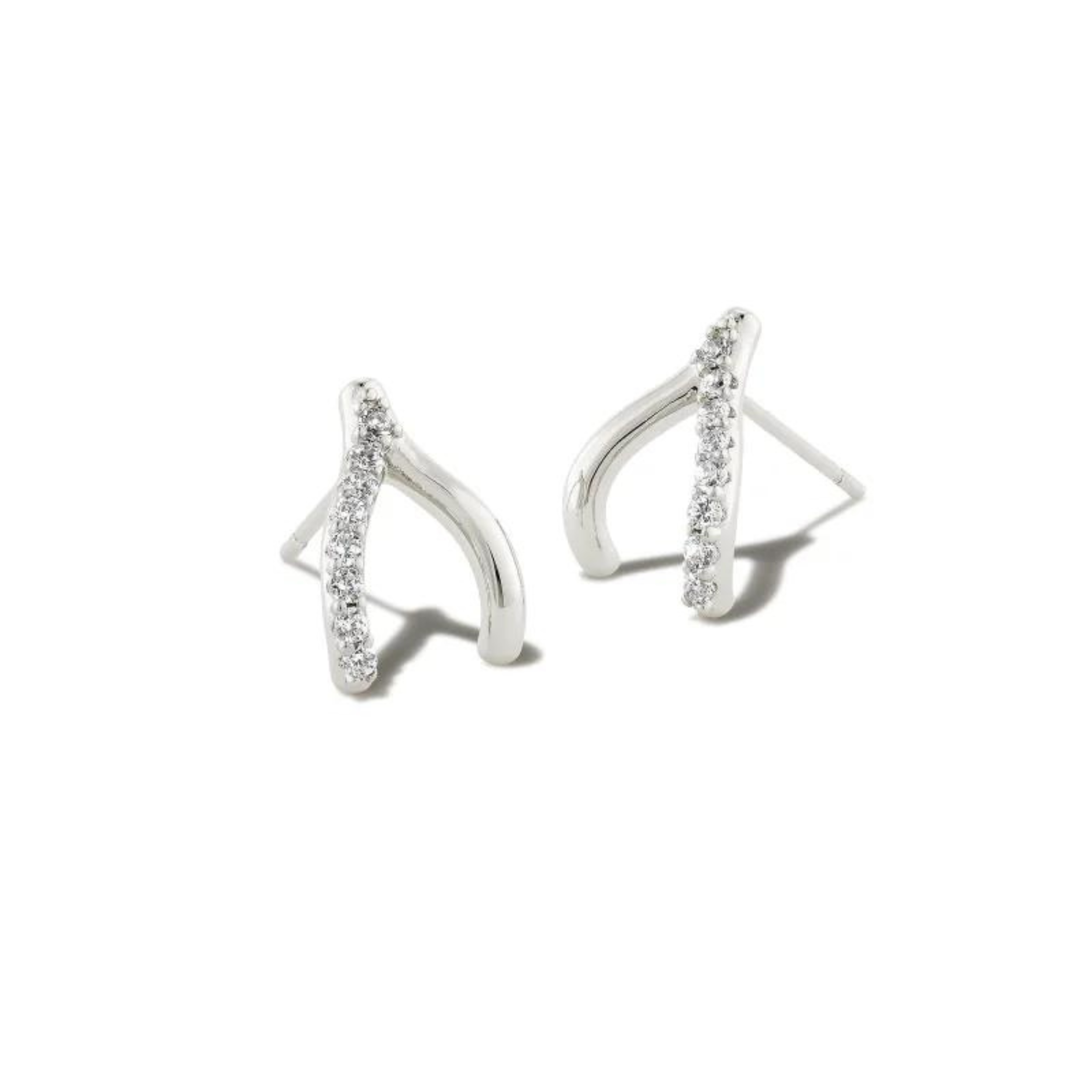 Silver wishbone shaped earrings with white crystals pictured on a white background.