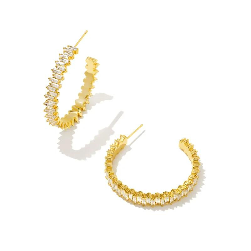 Gold hoop earrings with white crystals, pictured on a white background.