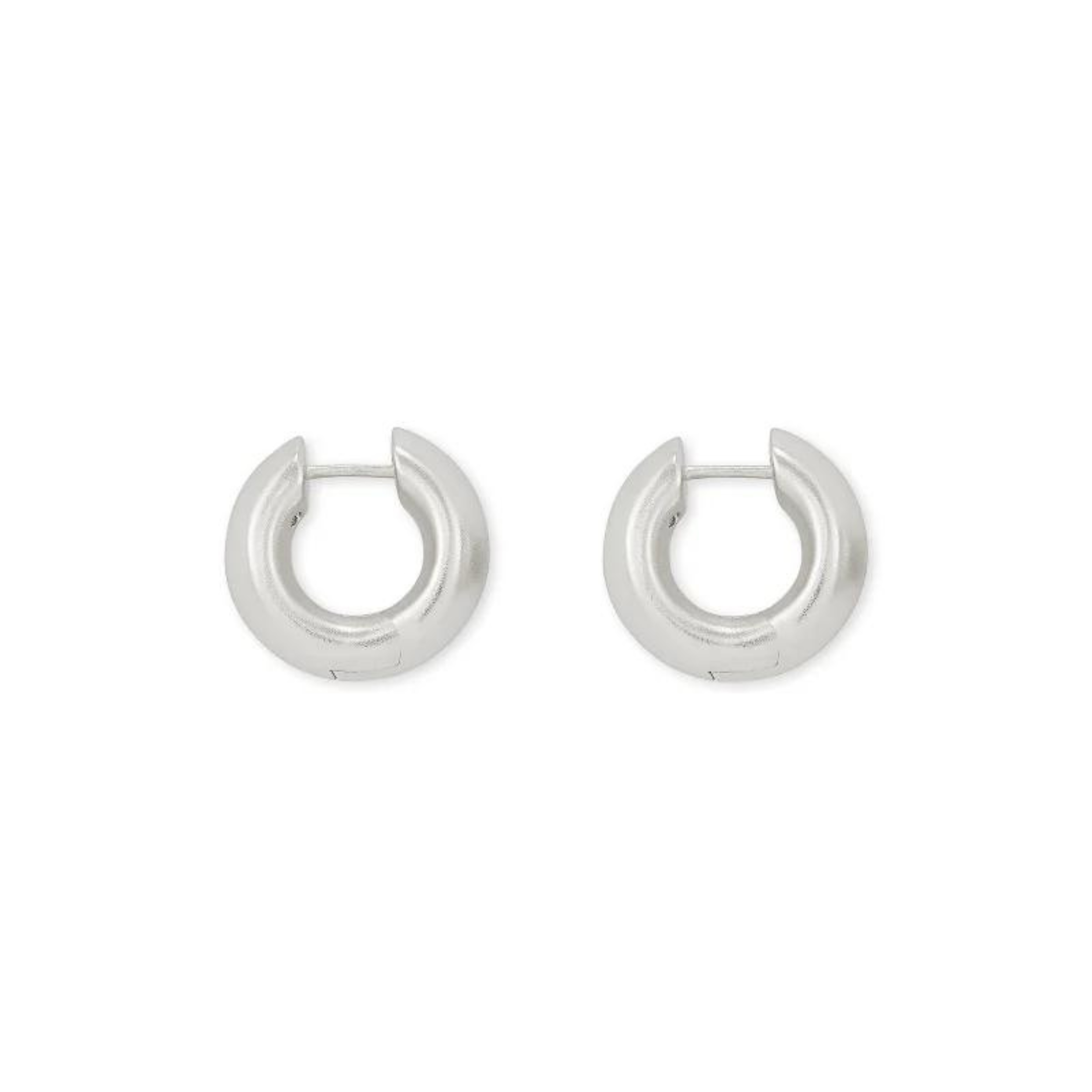 Silver huggie hoops pictured on a white background.