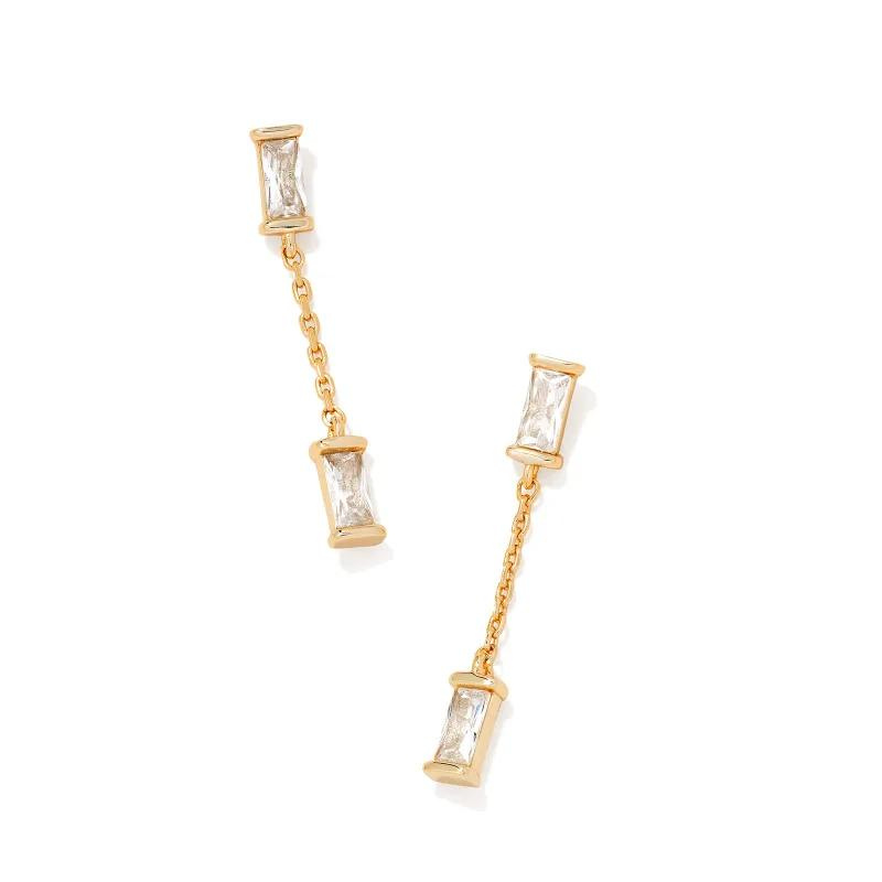 Gold white crystal dangle earrings, pictured on a white background.