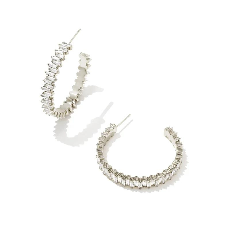 Silver hoop earrings with white crystals, pictured on a white bacground.