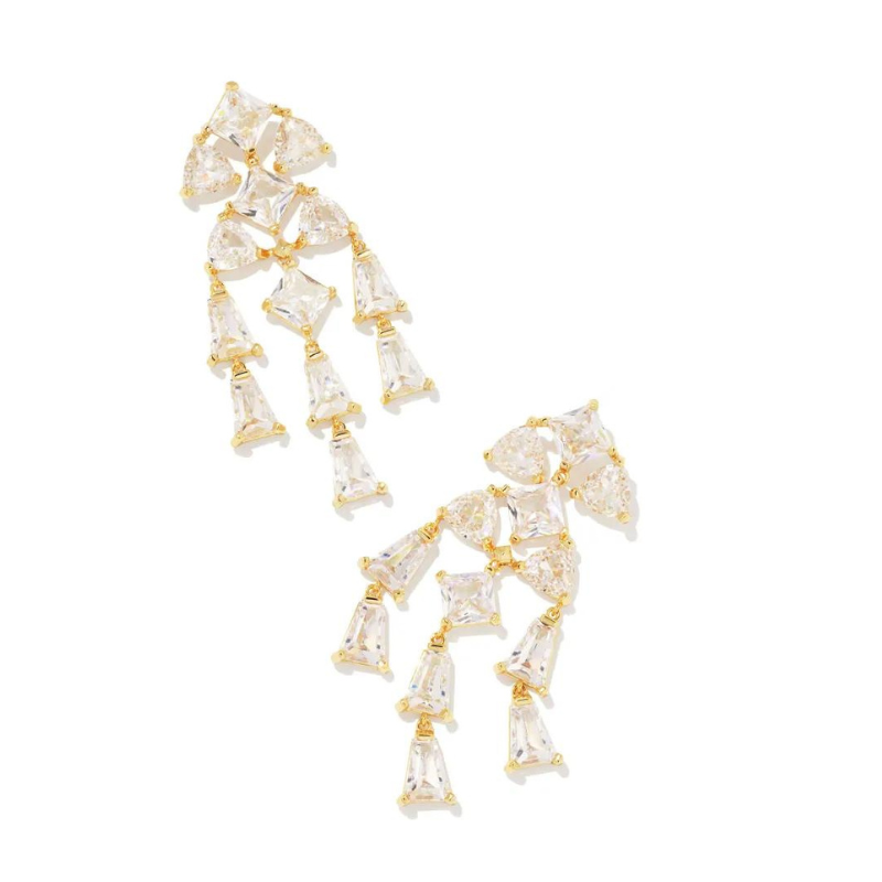Gold white crystal dangle earrings, pictured on a white background.