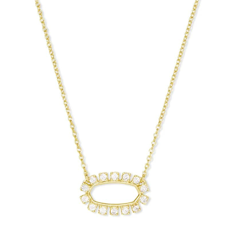 Gold necklace with open circle pendant with crystals, pictured on a white background.
