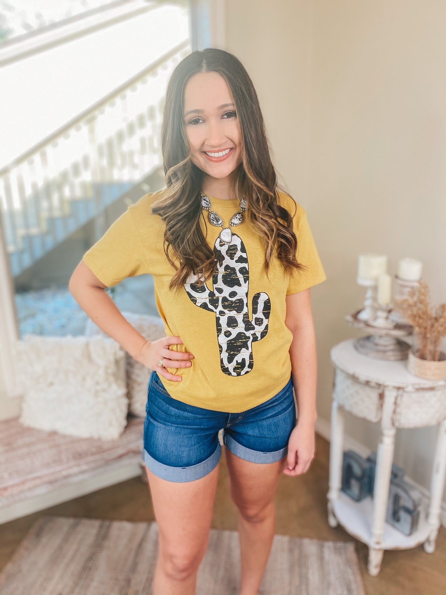 Steady as the Saguaros Cow Print Cactus Short Sleeve Graphic Tee in Mustard - Giddy Up Glamour Boutique