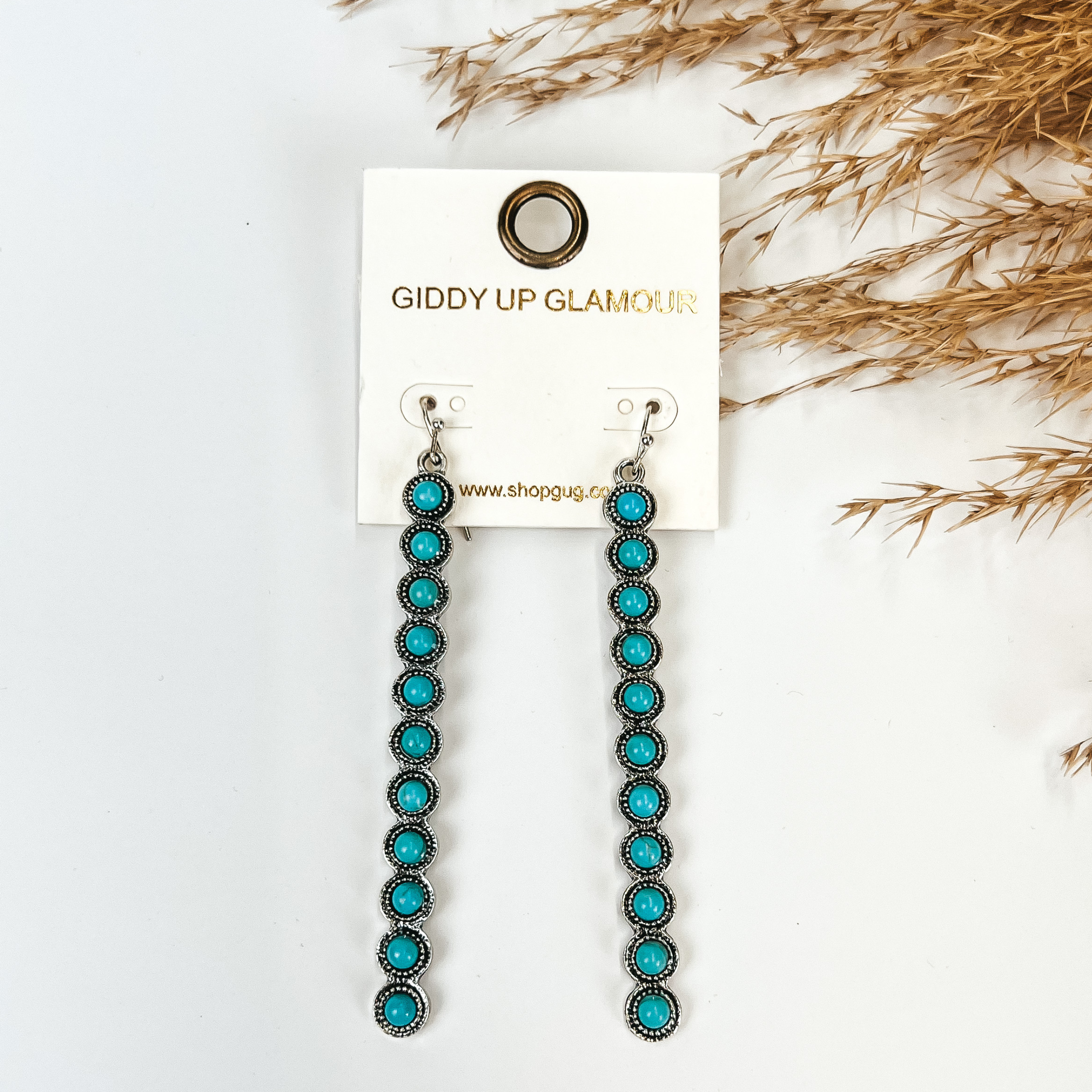 Turquoise Studded Long Rectangle Earrings in Silver Tone, with Pampas grass, with a white background. 