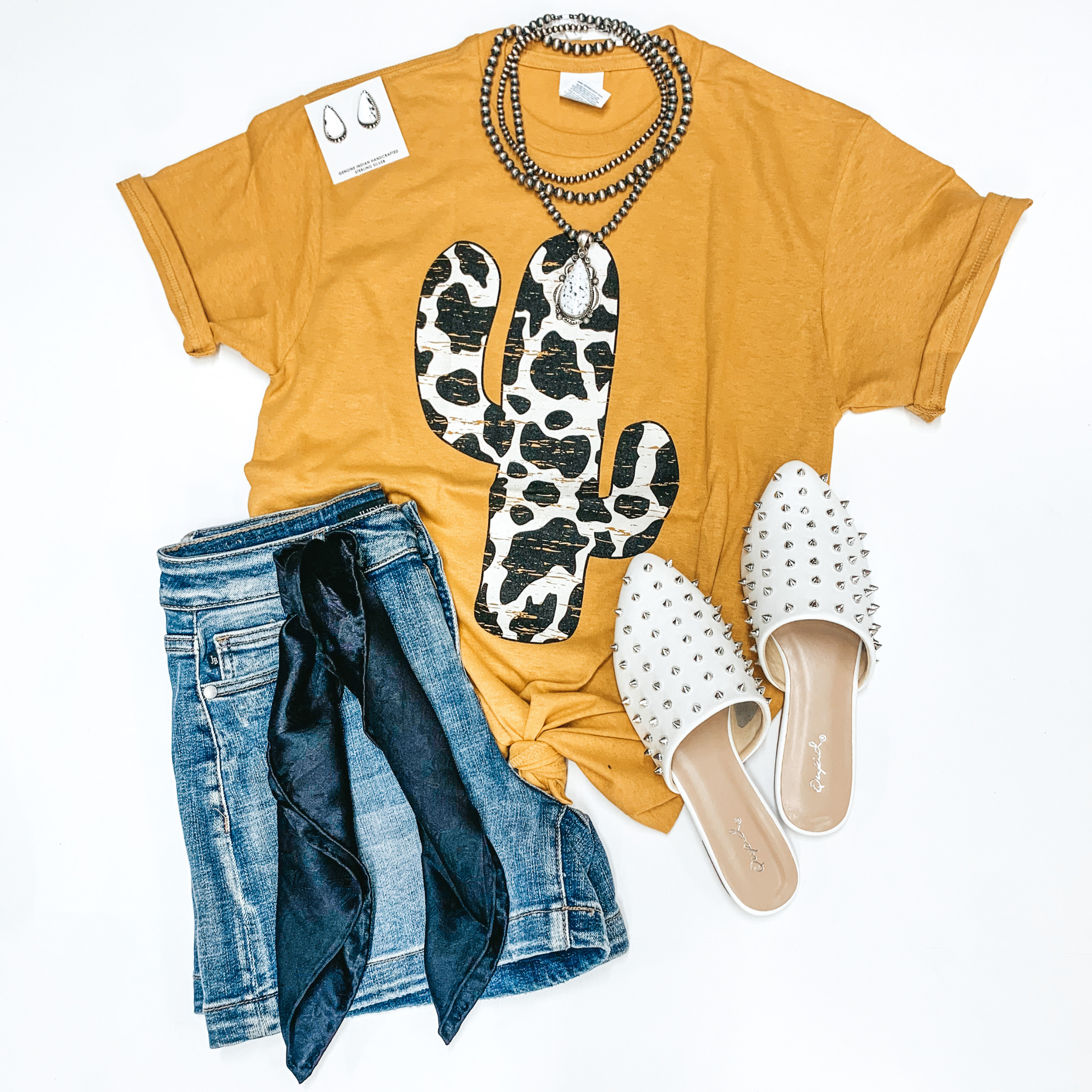 Steady as the Saguaros Cow Print Cactus Short Sleeve Graphic Tee in Mustard - Giddy Up Glamour Boutique