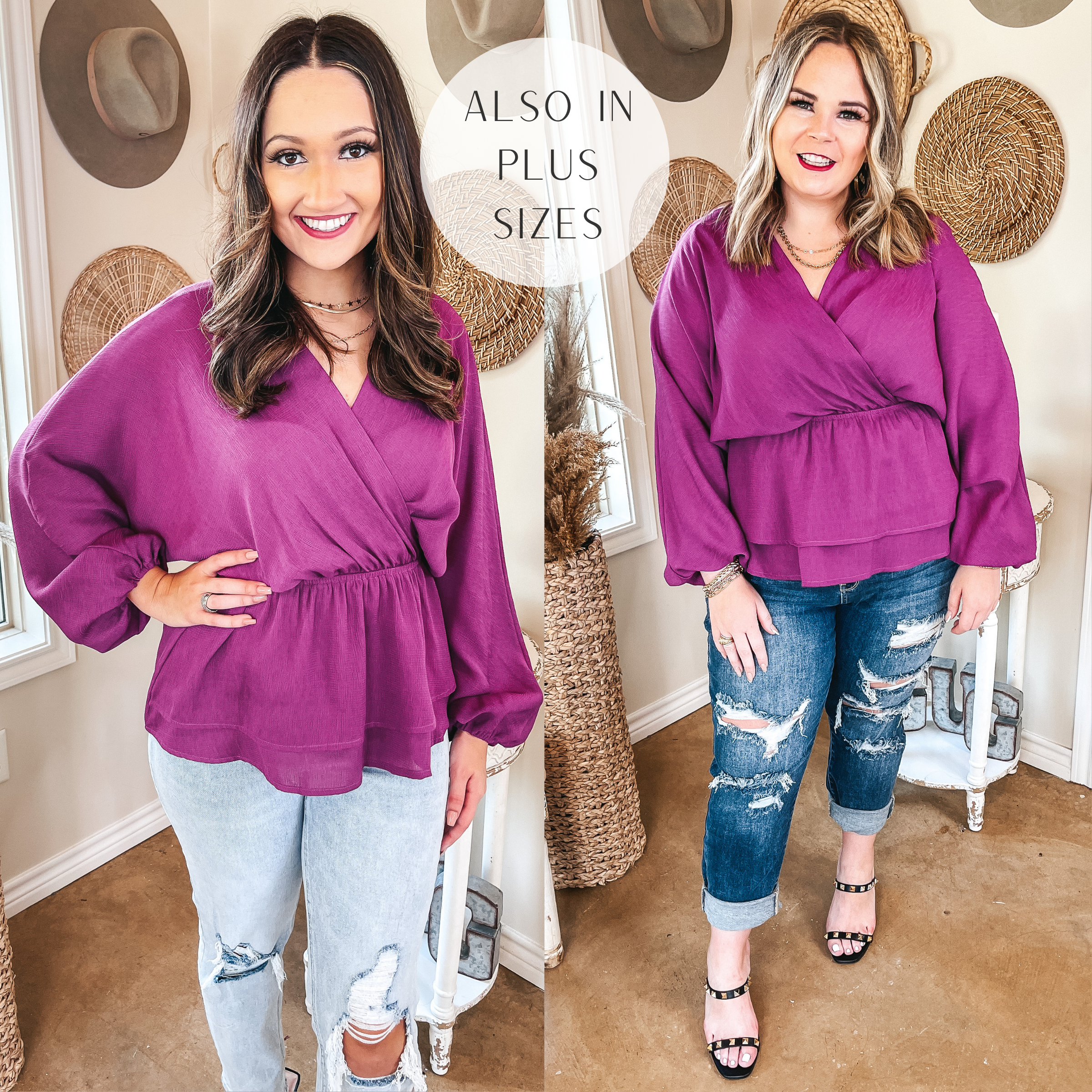 Two models are both wearing a magenta wrap long sleeve top. The model on the left is also wearing light wash ripped jeans and layered necklaces. The plus size model on the right is wearing the magenta blouse with medium wash ripped jeans, layered necklaces, and black studded strappy heels. 