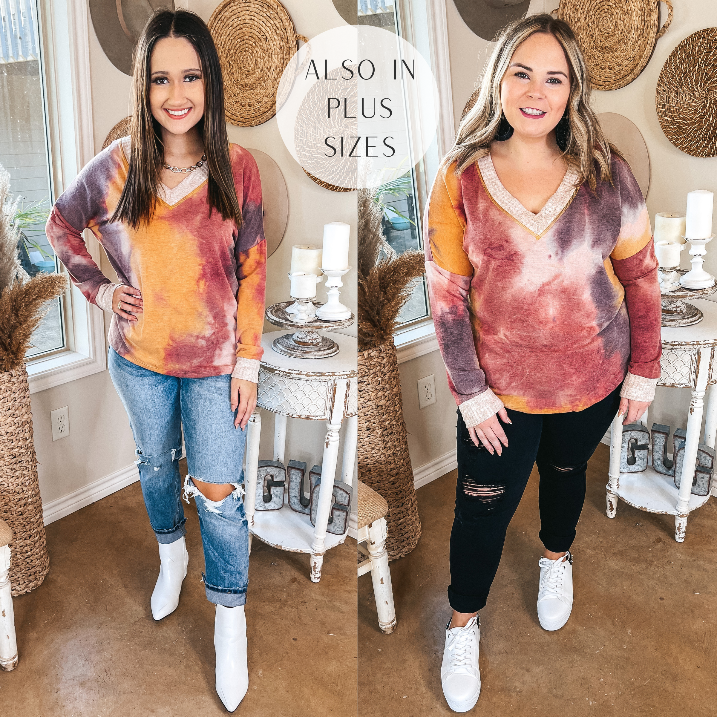 Models are wearinh tie dye long sleeve v neck tops with waffle knit trim. Regular size model has top paired with boyfriend jeans and white booties. Plus size model has it paired with black jeans and white sneakers.