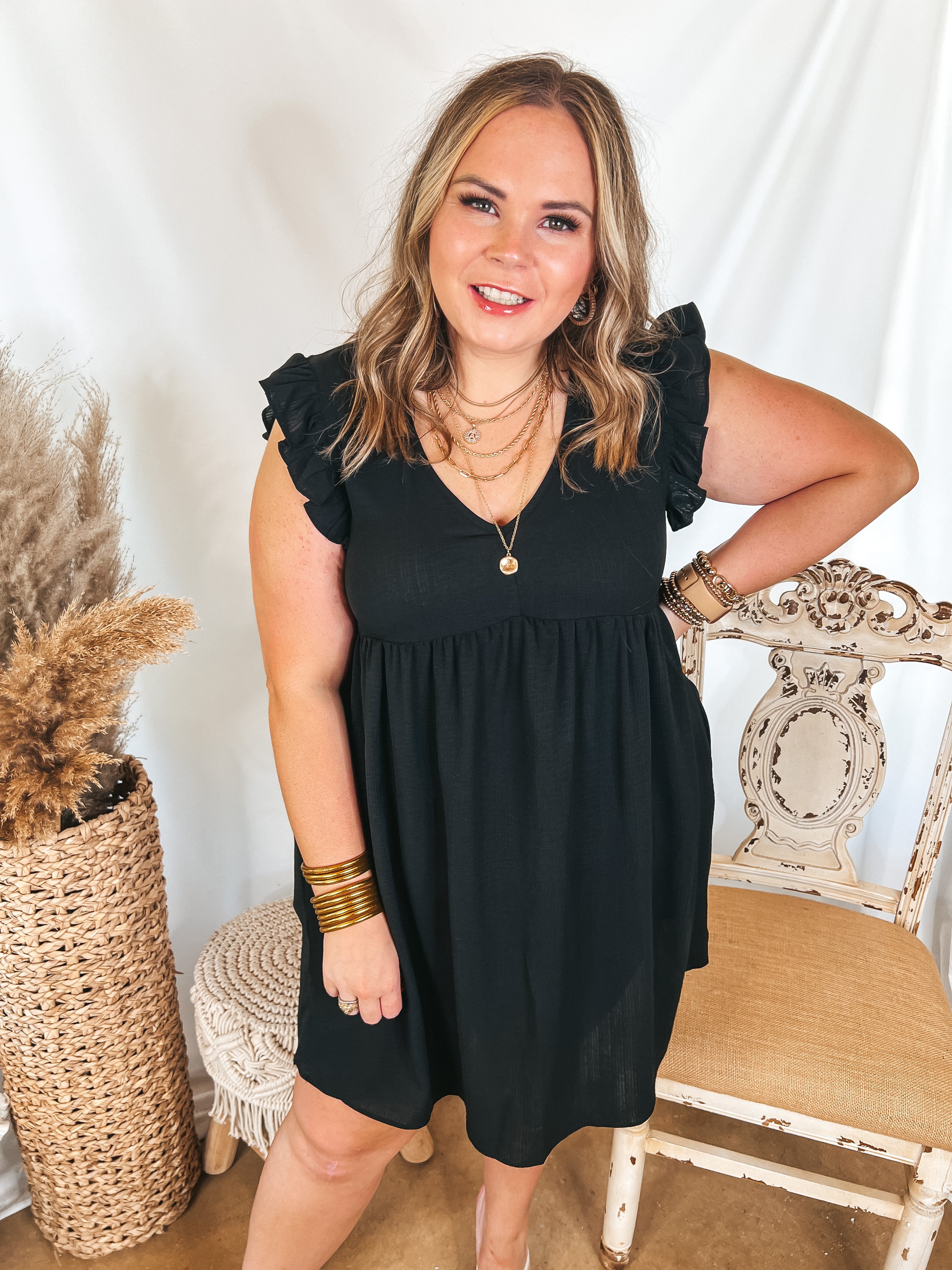 Capture Your Attention V Neck Dress with Ruffle Cap Sleeves in Black - Giddy Up Glamour Boutique