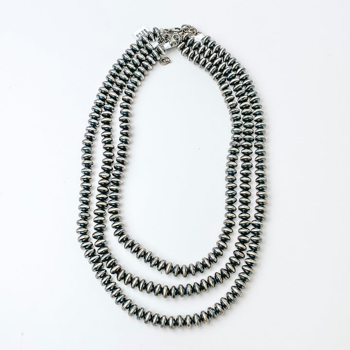 Centered in the picture is navajo pearls on a solid white background. 