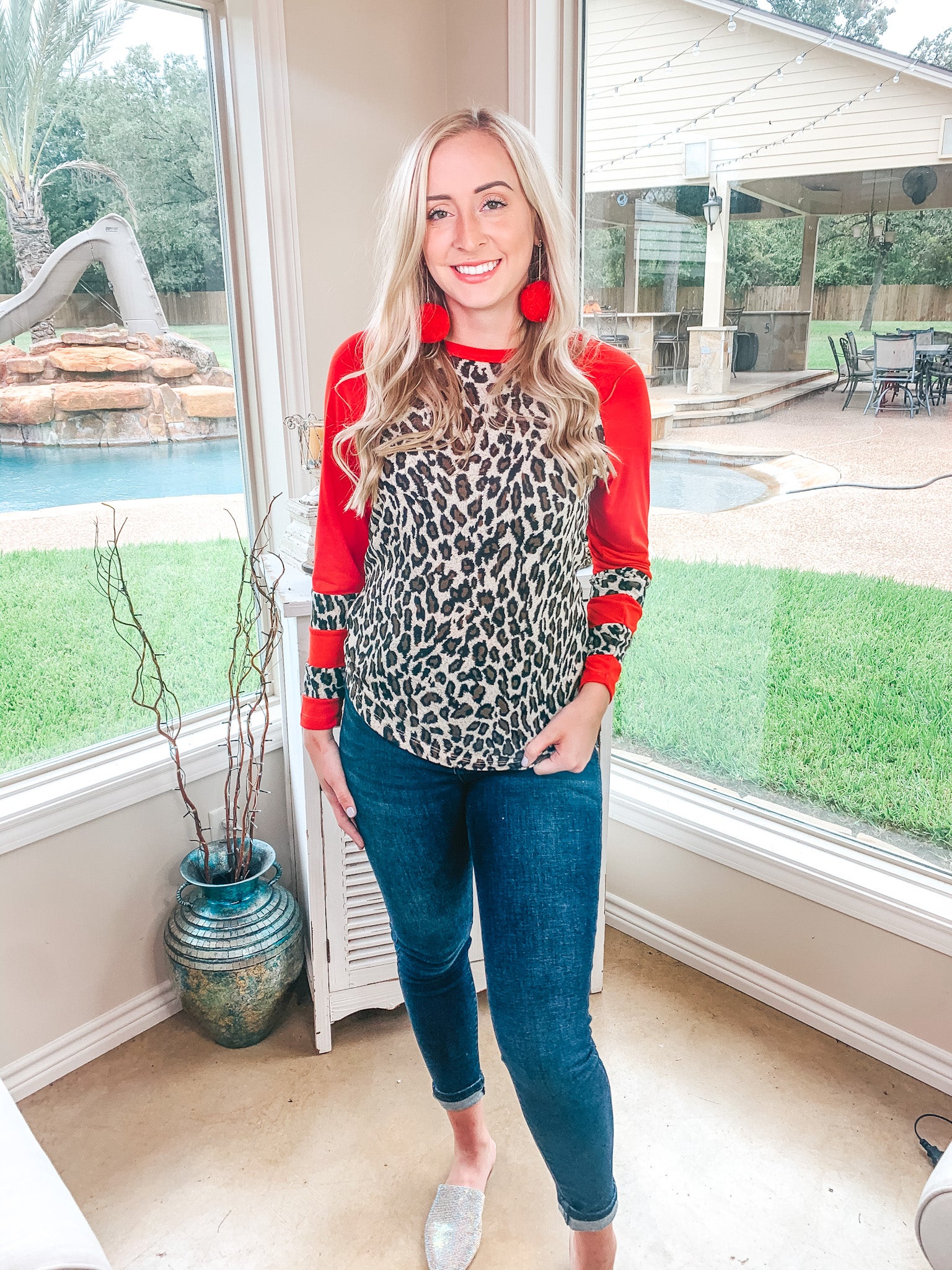 Earning Your Spots Leopard Long Sleeve Top with Color Block Sleeves in Red - Giddy Up Glamour Boutique