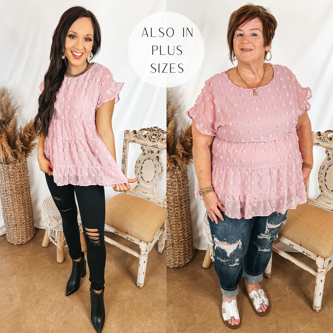 Models are wearing a mauve swiss dot babydoll top. Size small model has it paired with black distressed jeans, black booties, and silver jewelry. Plus size model has it paired with dark wash boyfriend jeans white sandals, and gold jewelry.