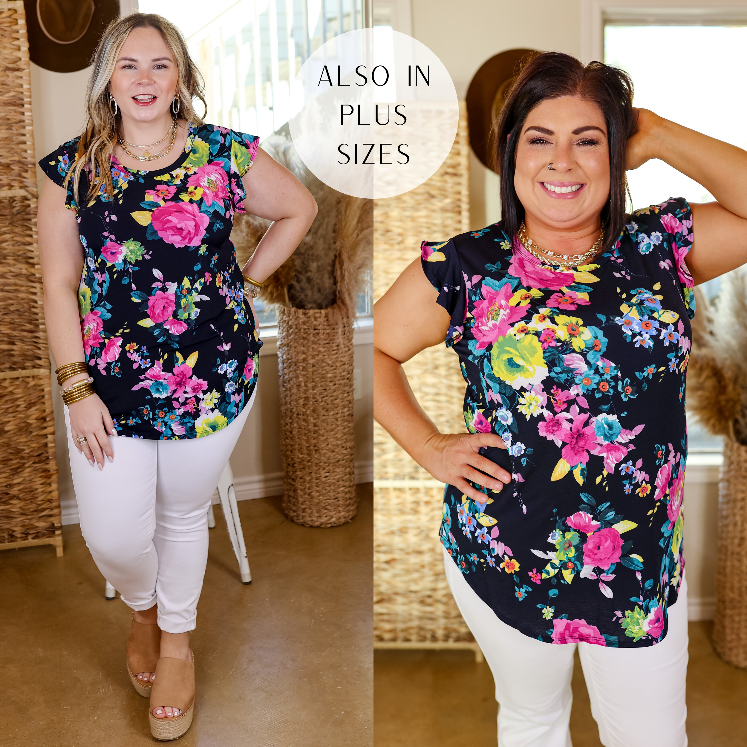 Model is wearing a ruffle sleeve top with multi colored flowers in navy. Model has this top paired with white jeans, gold jewelry, and wedges.