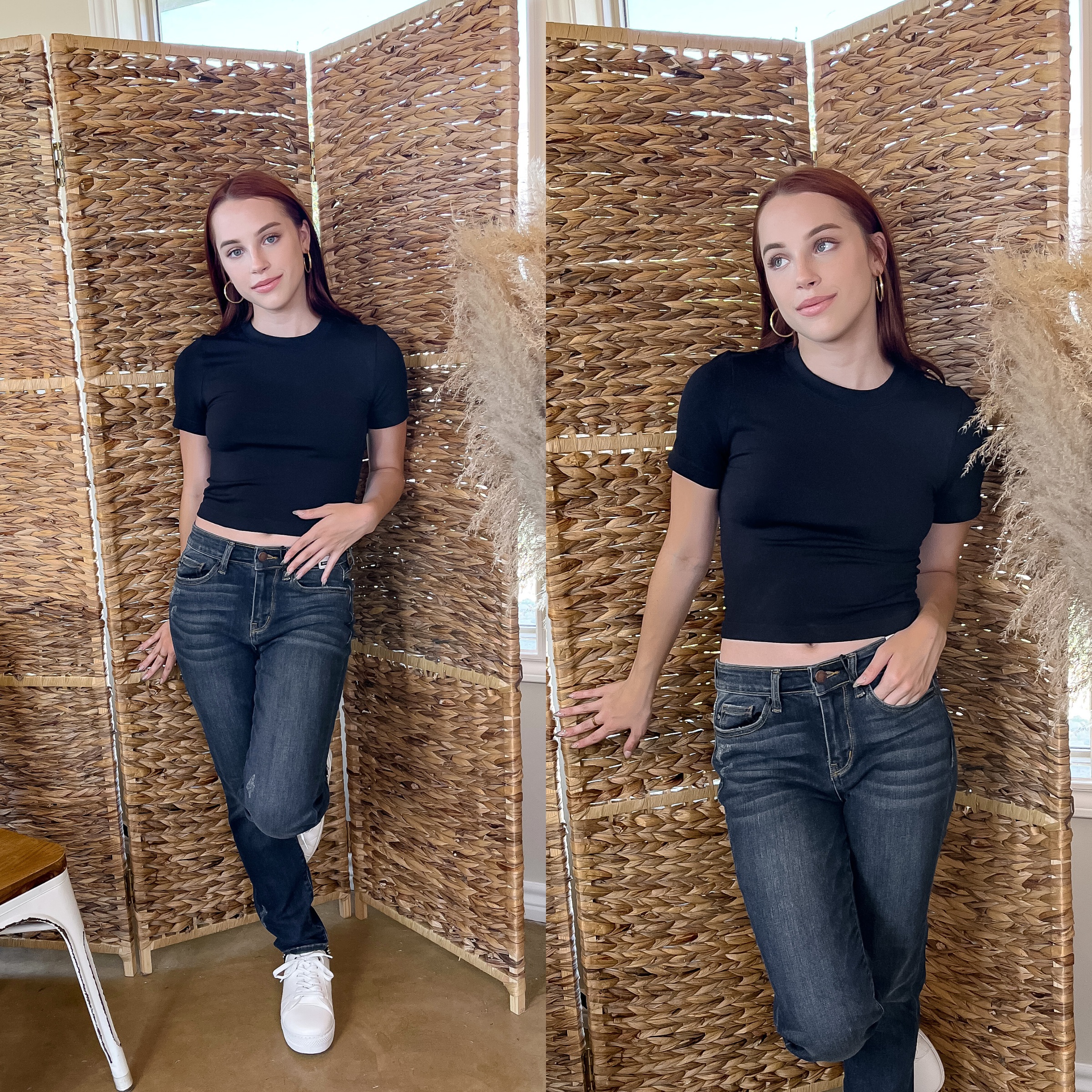 Model is wearing a black, high neck cropped short sleeve top with  dark blue jeans. She is also wearing gold hoops and white tennis shoes.