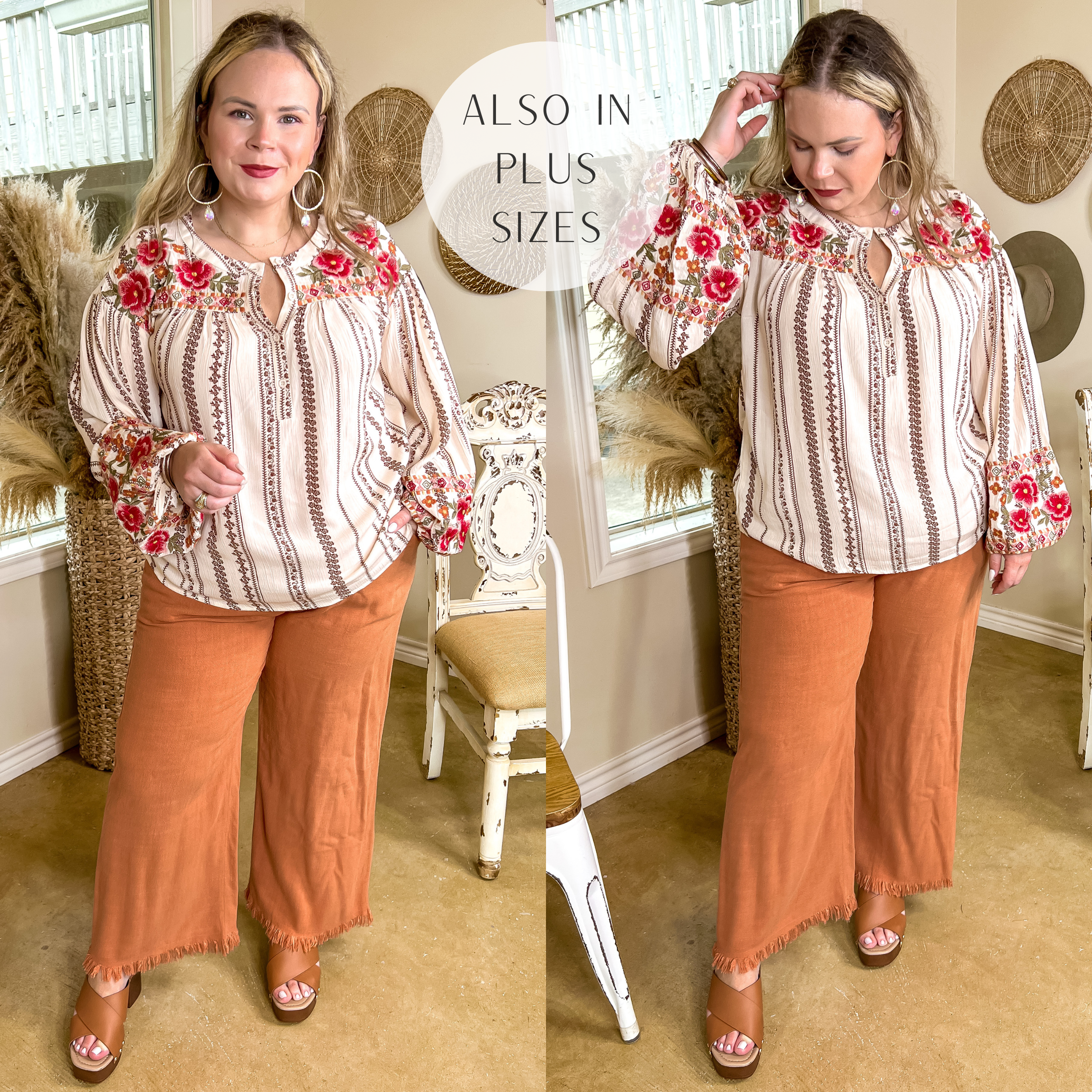 Model is wearing a tribal stripe long sleeve top with floral embroidery and a half button up front. Model has it paired with clay orange pants, brown wedges, and gold jewelry.