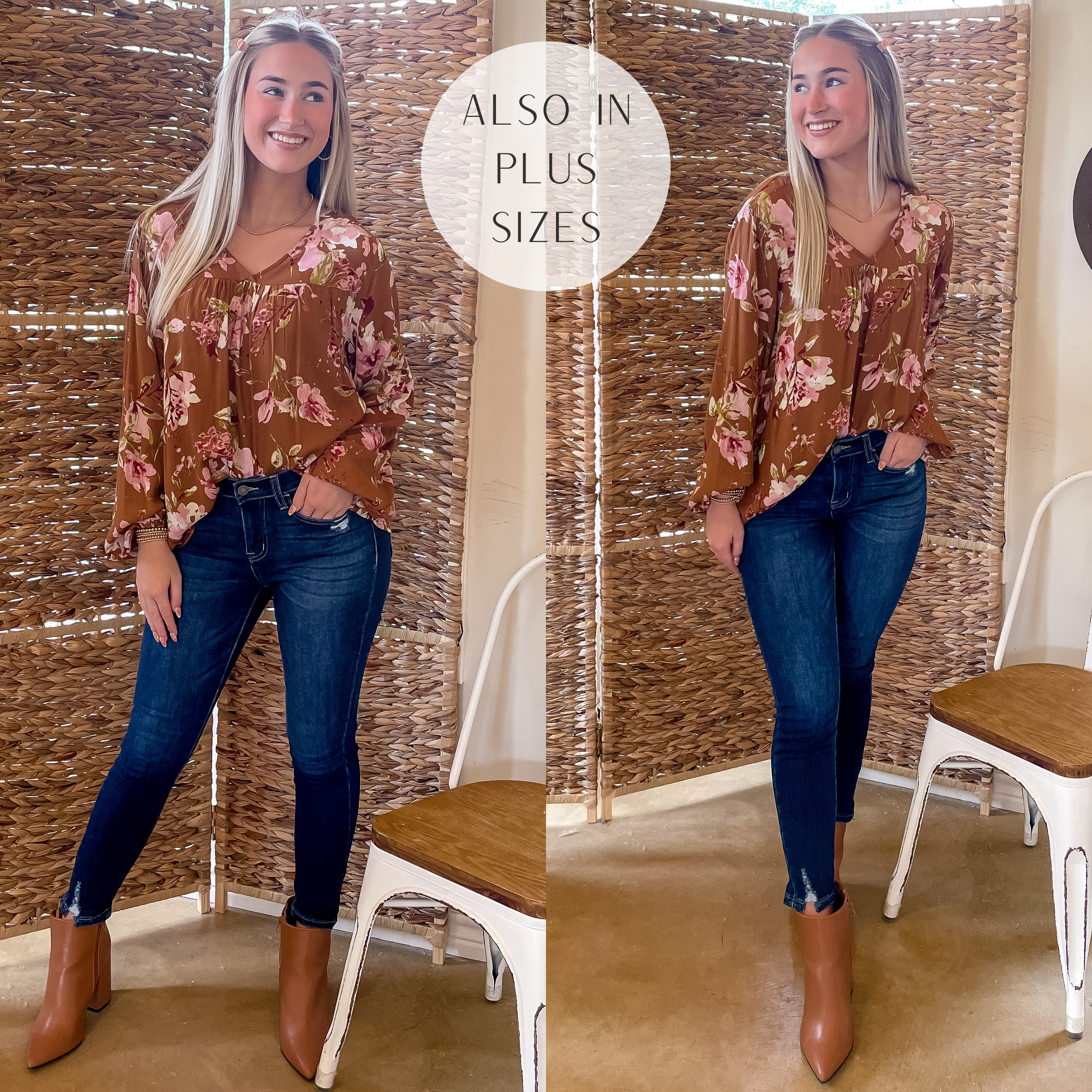 Model is wearing a camel brown top with long sleeves and a blush pink floral print. Model has it paired with dark wash skinny jeans, tan booties, and gold jewelry.