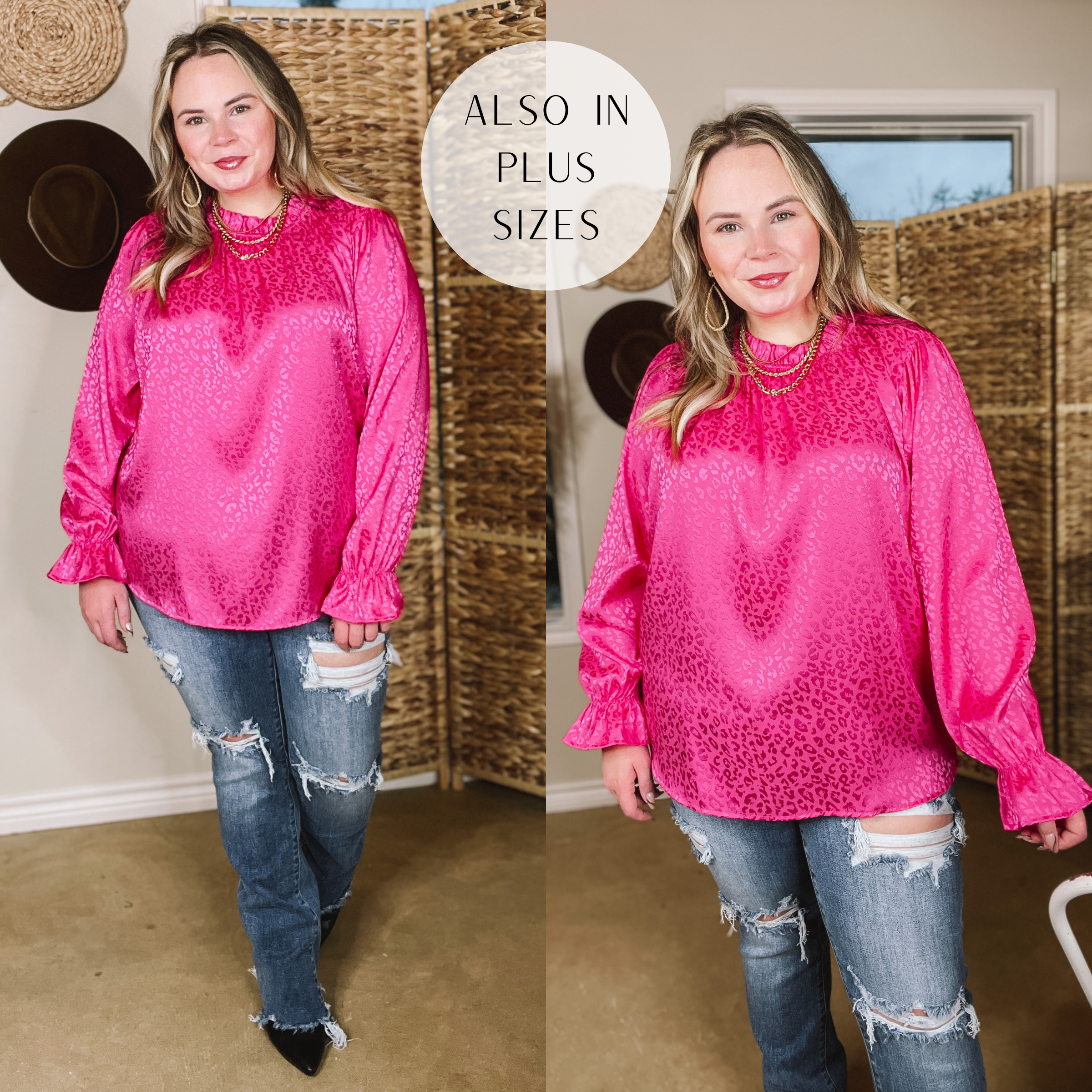 Model is wearing a hot pink satin long sleeve shirt in a leopard print with a ruffled detail around the wrist. Model has this top paired with distressed jeans and black booties with a gold necklace and earrings. Background is brown.
