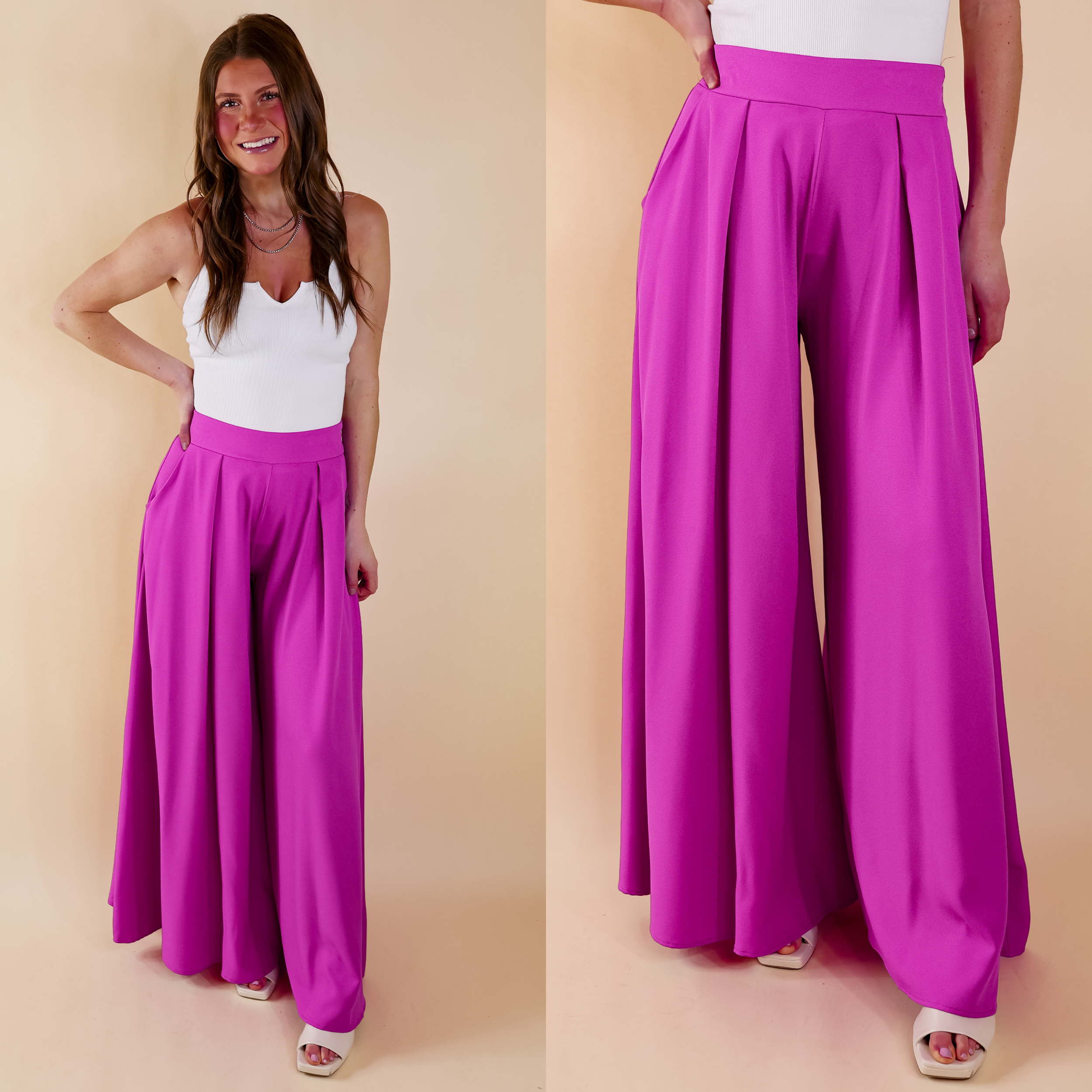 Model is wearing a pair of purple pants with pleated detail on the front and a super wide leg. Model has it paired with a white tank top, ivory heels, and silver jewelry.