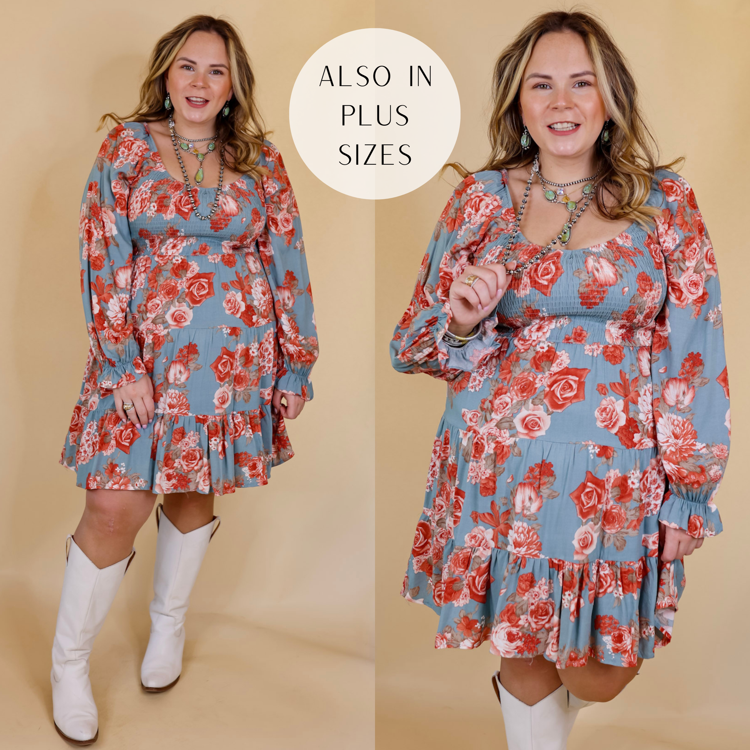 Model is wearing a long sleeve floral dress with a smocked bodice in dusty blue. Model has this dress paired with tall, white boots and Navajo jewelry. Background is solid tan.