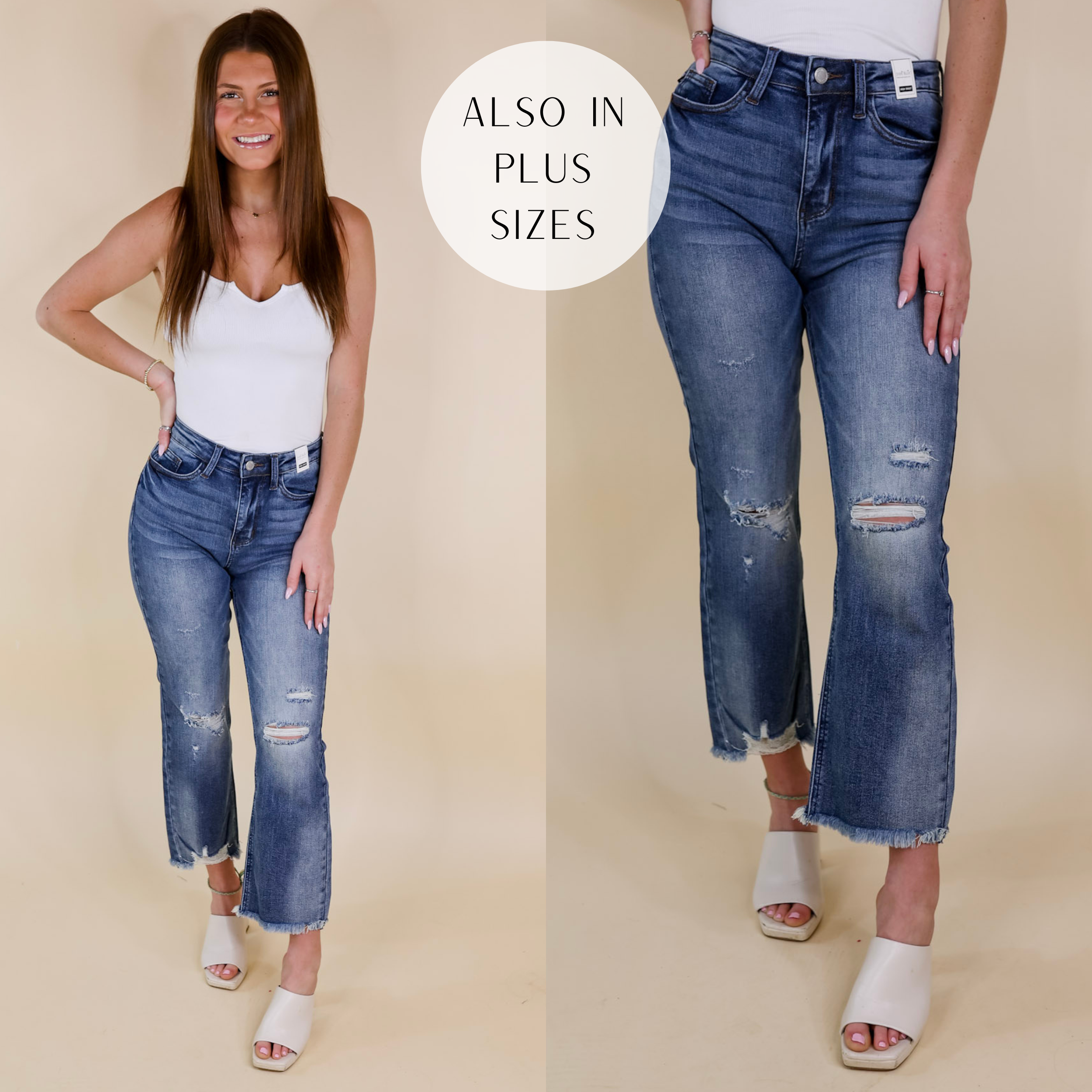 Model is wearing a pair of distressed cropped jeans in a medium wash. Model has these jeans paired with a white tank top, ivory heels, and gold jewelry.