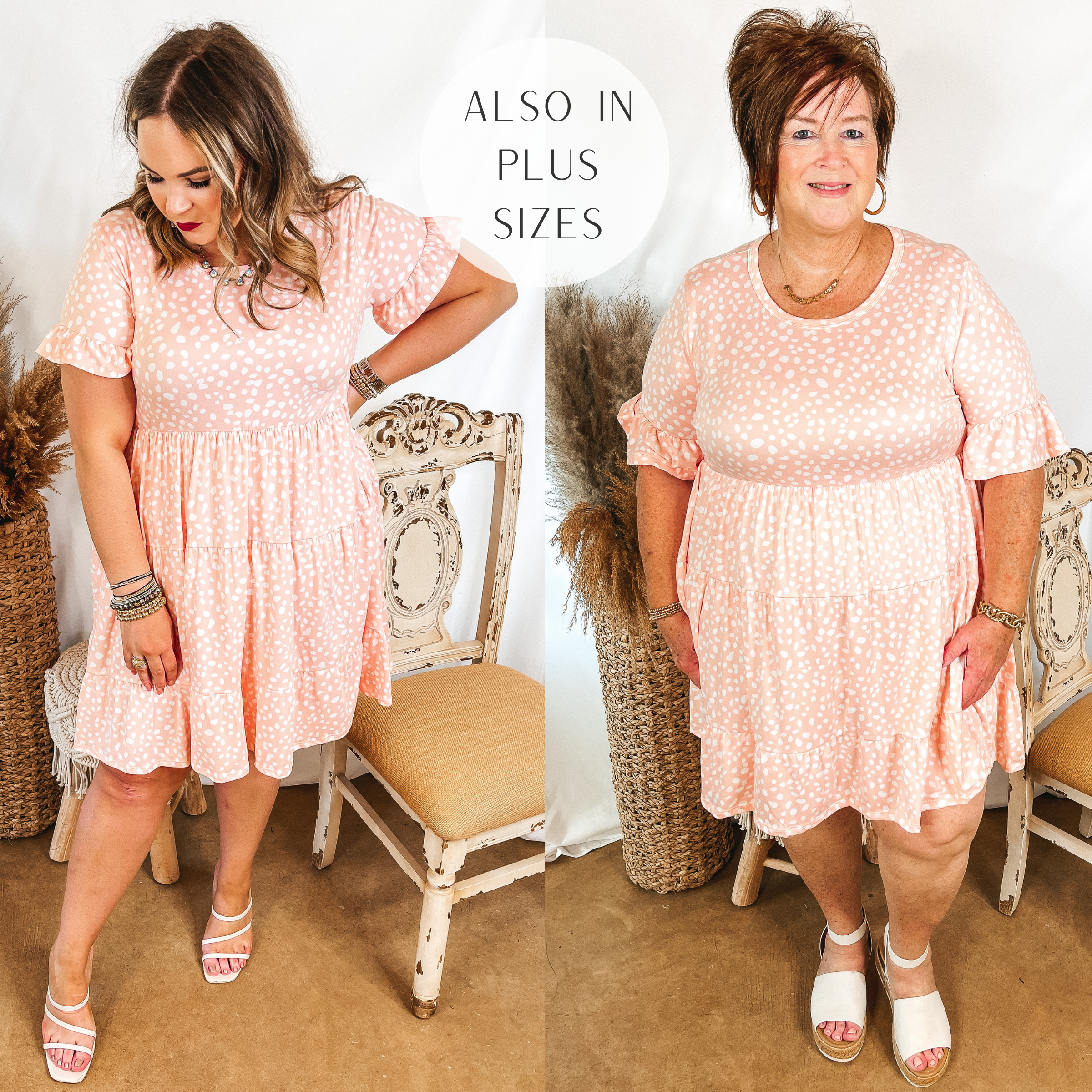 Models are wearing a peach pink dress with a white dotted print. Size large model has this babydoll dress paired with white strappy heels and silver jewelry. Plus size model has it paired with white sandals and gold jewelry.
