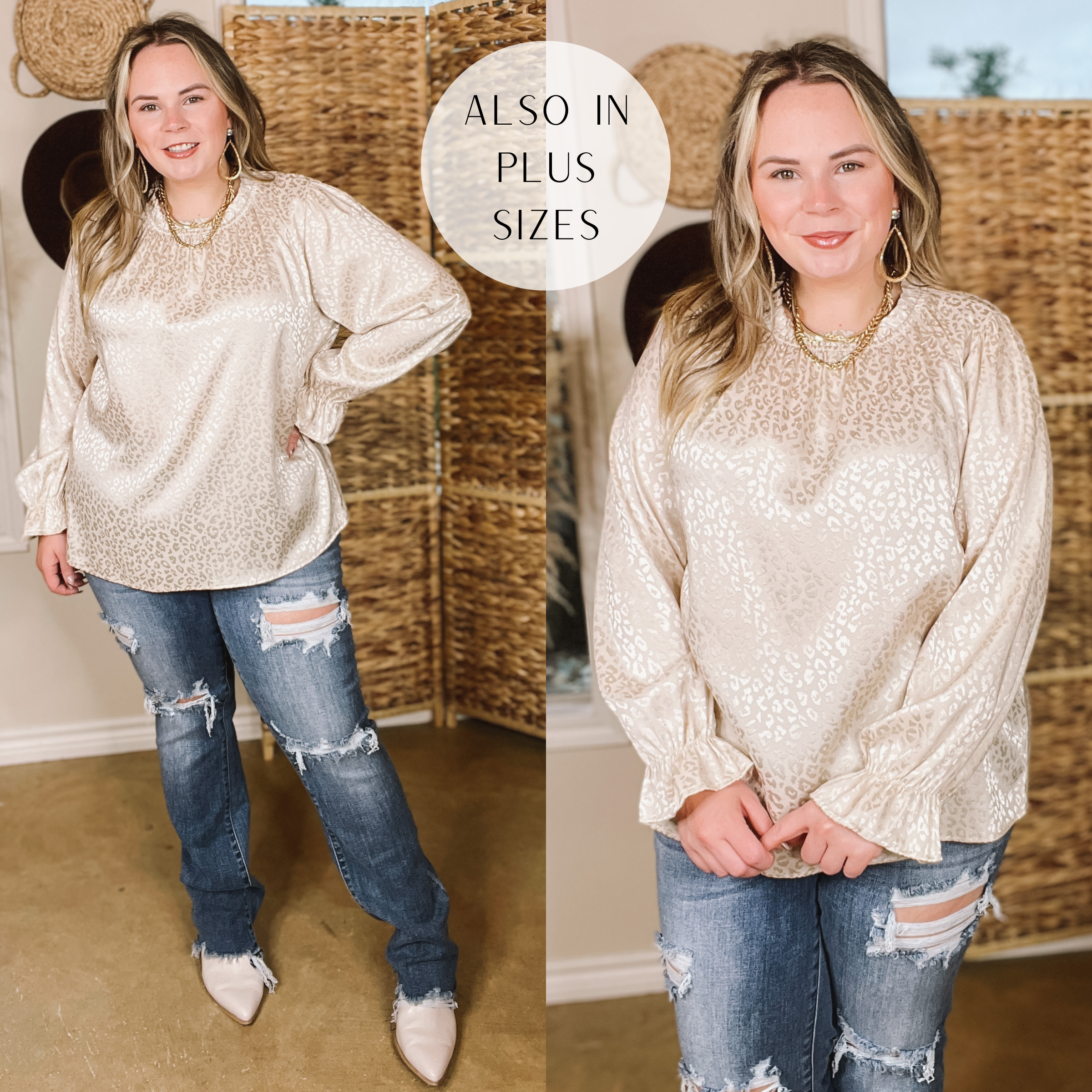 Model is wearing a ivory satin long sleeve shirt in a leopard print with ruffled cuffed sleeves around the wrist. Model is wearing white mules, distressed jeans, and has this outfit paired with gold jewelry. The background is hues of brown and white.  